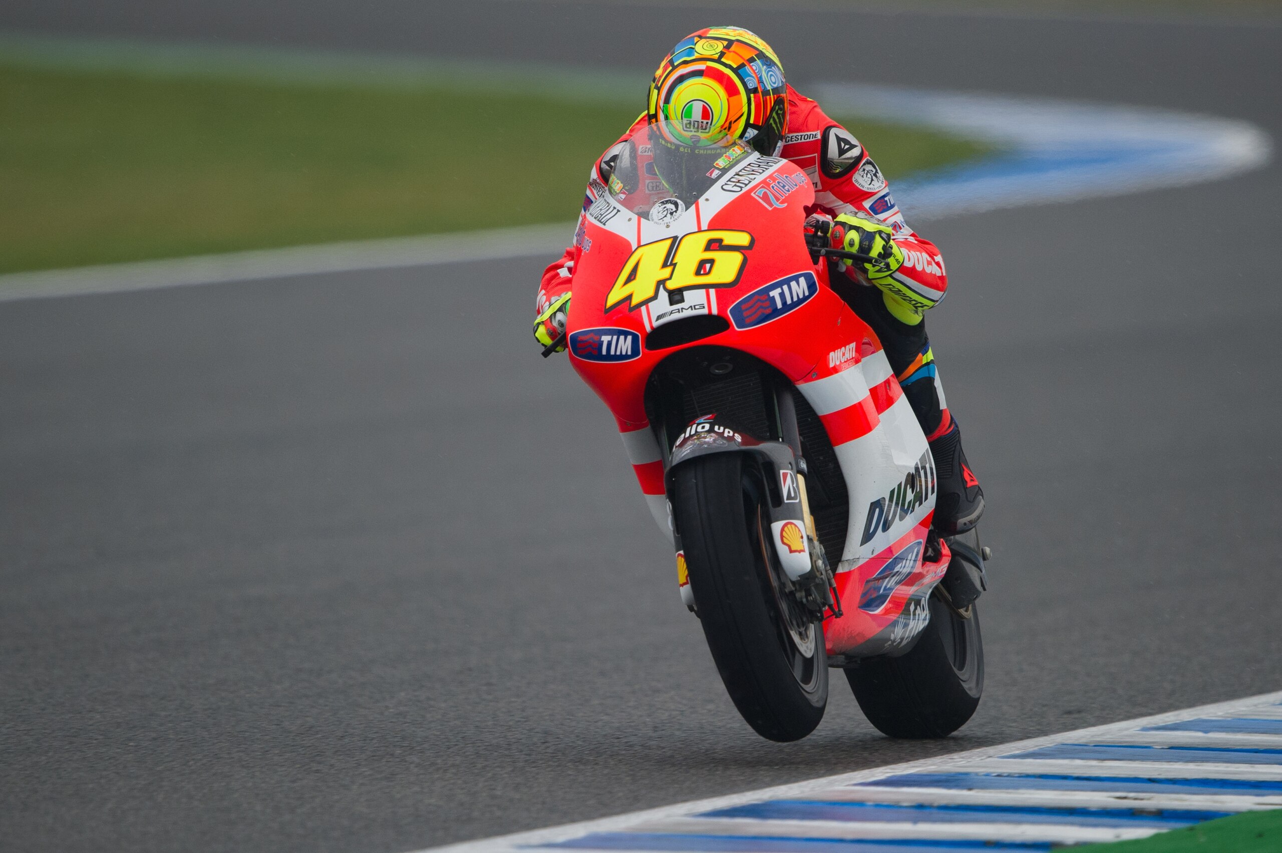 JEREZ DE LA FRONTERA, SPAIN - APRIL 03:  Valentino Rossi of Italy  and Ducati Marlboro Team  lifts the front wheel during the MotoGP race at Circuito de Jerez on April 3, 2011 in Jerez de la Frontera, Spain.  (Photo by Mirco Lazzari gp/Getty Images)