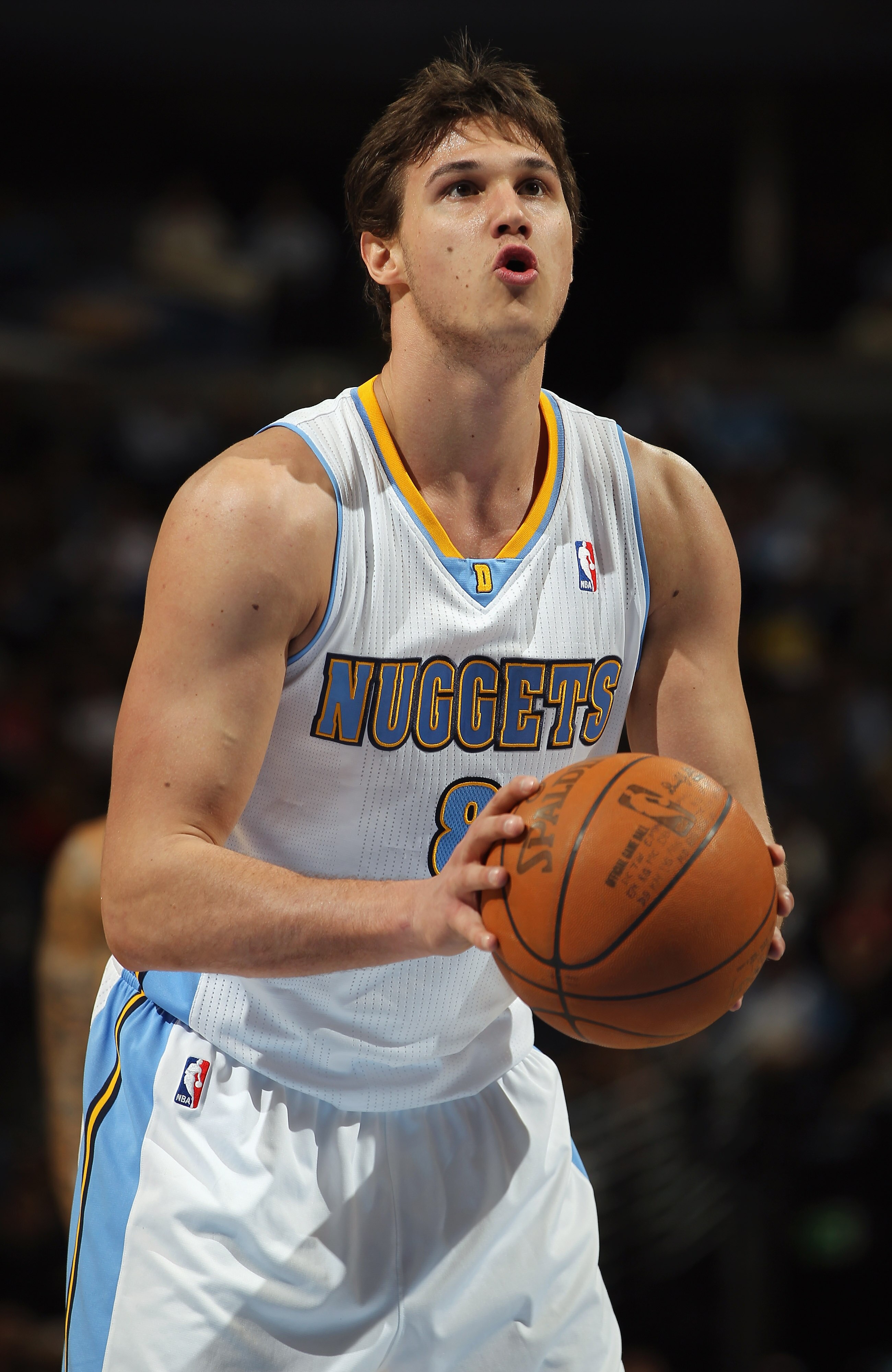 DENVER, CO - MARCH 23:  Danilo Gallinari #8 of the Denver Nuggets takes a free throw against the San Antonio Spurs at the Pepsi Center on March 23, 2011 in Denver, Colorado. The Nuggets defeated the Spurs 115-112. NOTE TO USER: User expressly acknowledges