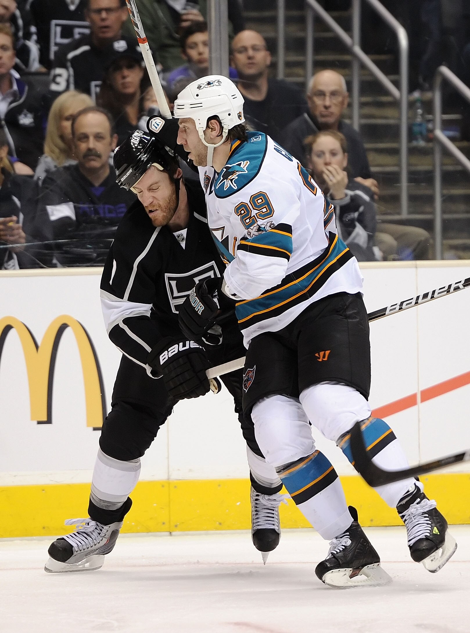 LOS ANGELES, CA - APRIL 19:  Rob Scuderi #7 of the Los Angeles Kings fights for position with Ryane Clowe #29 of the San Jose Sharks in the third period of game three of the Western Conference Quarterfinals during the 2011 NHL Stanley Cup Playoffs at Stap