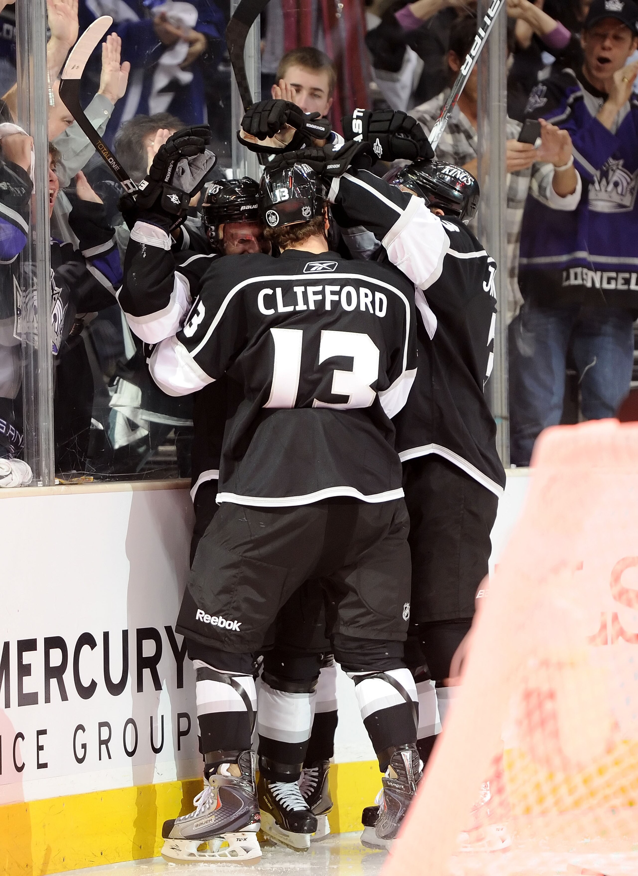 LOS ANGELES, CA - APRIL 19:  Brad Richardson #15 of the Los Angeles Kings celebrates a goal against the San Jose Sharks with teammates in the second period of game three of the Western Conference Quarterfinals during the 2011 NHL Stanley Cup Playoffs at S