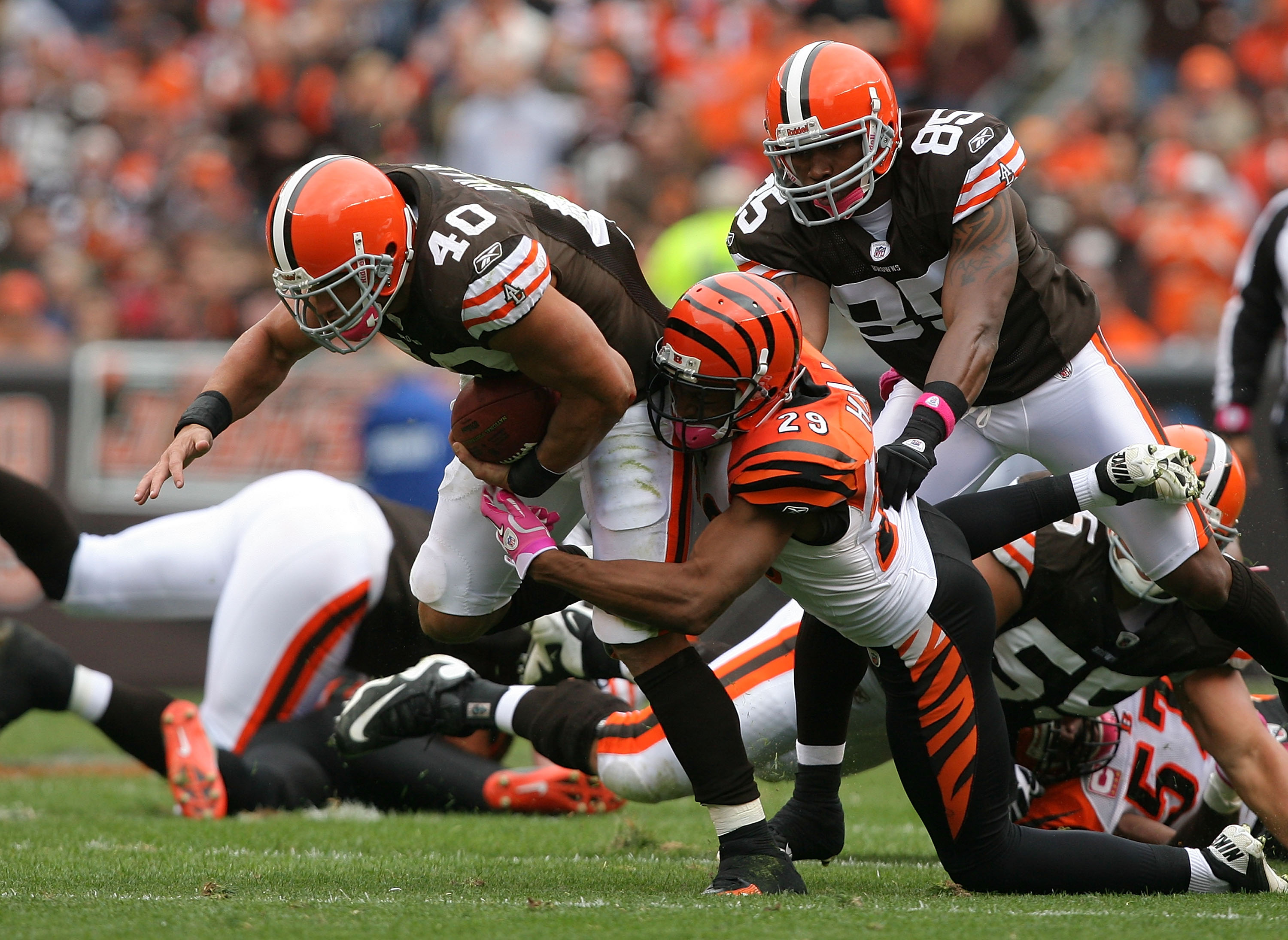 CLEVELAND - OCTOBER 03:  Running back Peyton Hillis #40 of the Cleveland Browns is hit by cornerback Leon Hall #29 of the Cincinnati Bengals at Cleveland Browns Stadium on October 3, 2010 in Cleveland, Ohio.  (Photo by Matt Sullivan/Getty Images)
