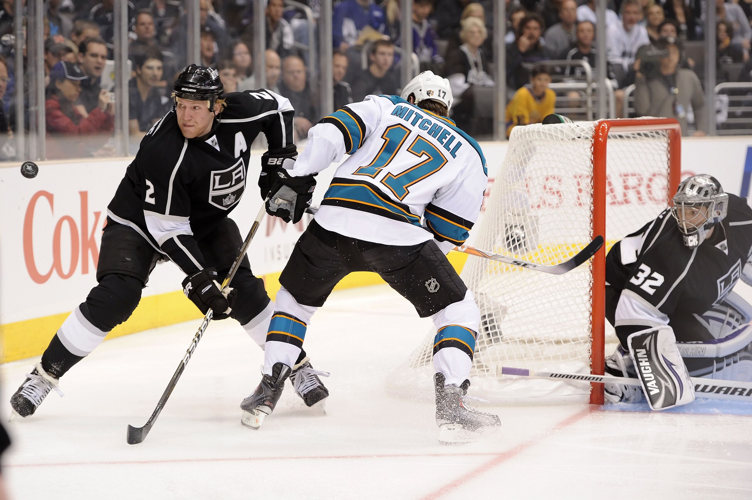 LOS ANGELES, CA - APRIL 19:  Matt Greene #2 of the Los Angeles Kings fights for possesion of the puck with Torrey Mitchell #17 of the San Jose Sharks in the first period of game three of the Western Conference Quarterfinals during the 2011 NHL Stanley Cup