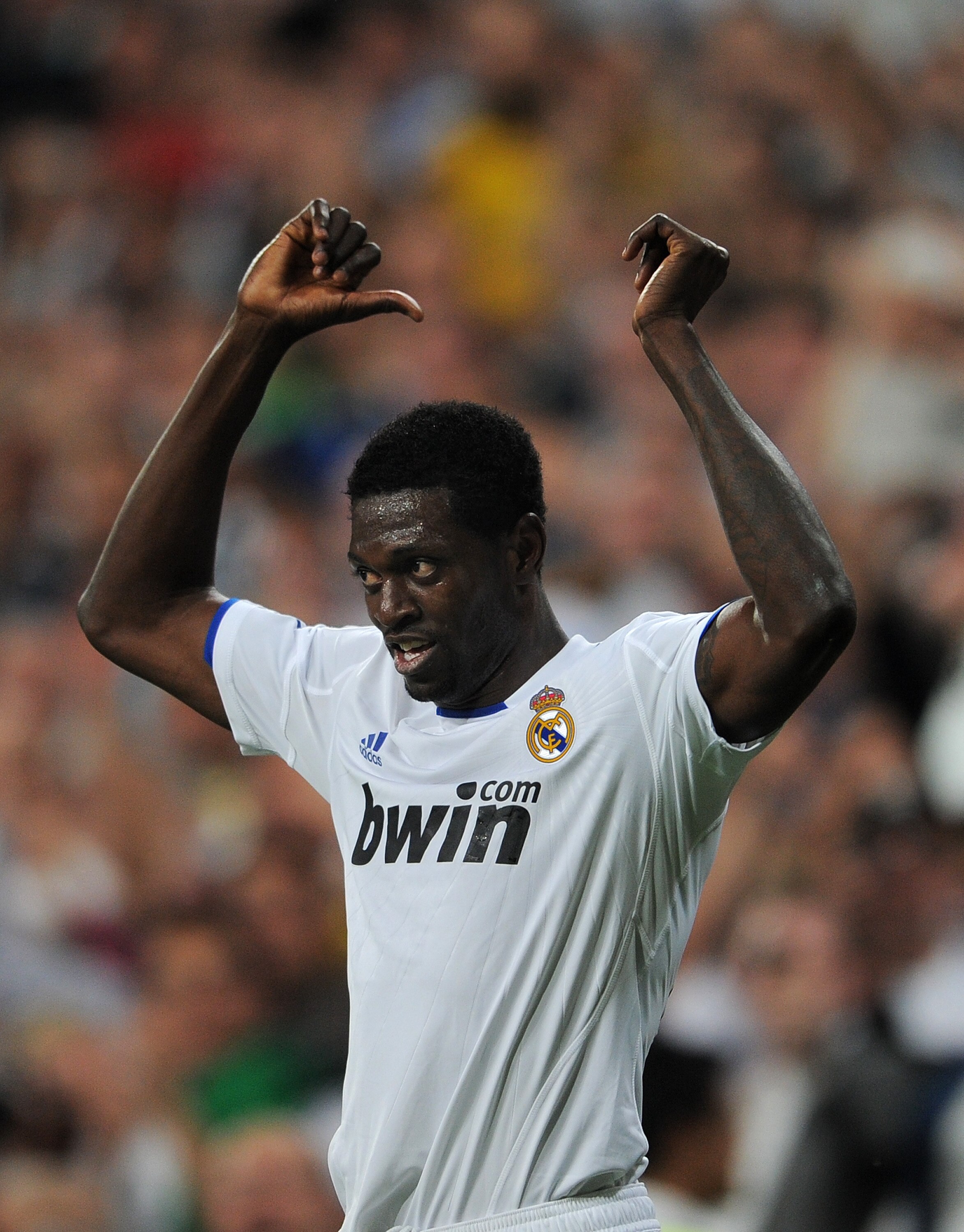 MADRID, SPAIN - APRIL 05:  Emmanuel Adebayor of Real Madrid celebrates scoring his second goal during the UEFA Champions League quarter final first leg match between Real Madrid and Tottenham Hotspur at Estadio Santiago Bernabeu on April 5, 2011 in Madrid