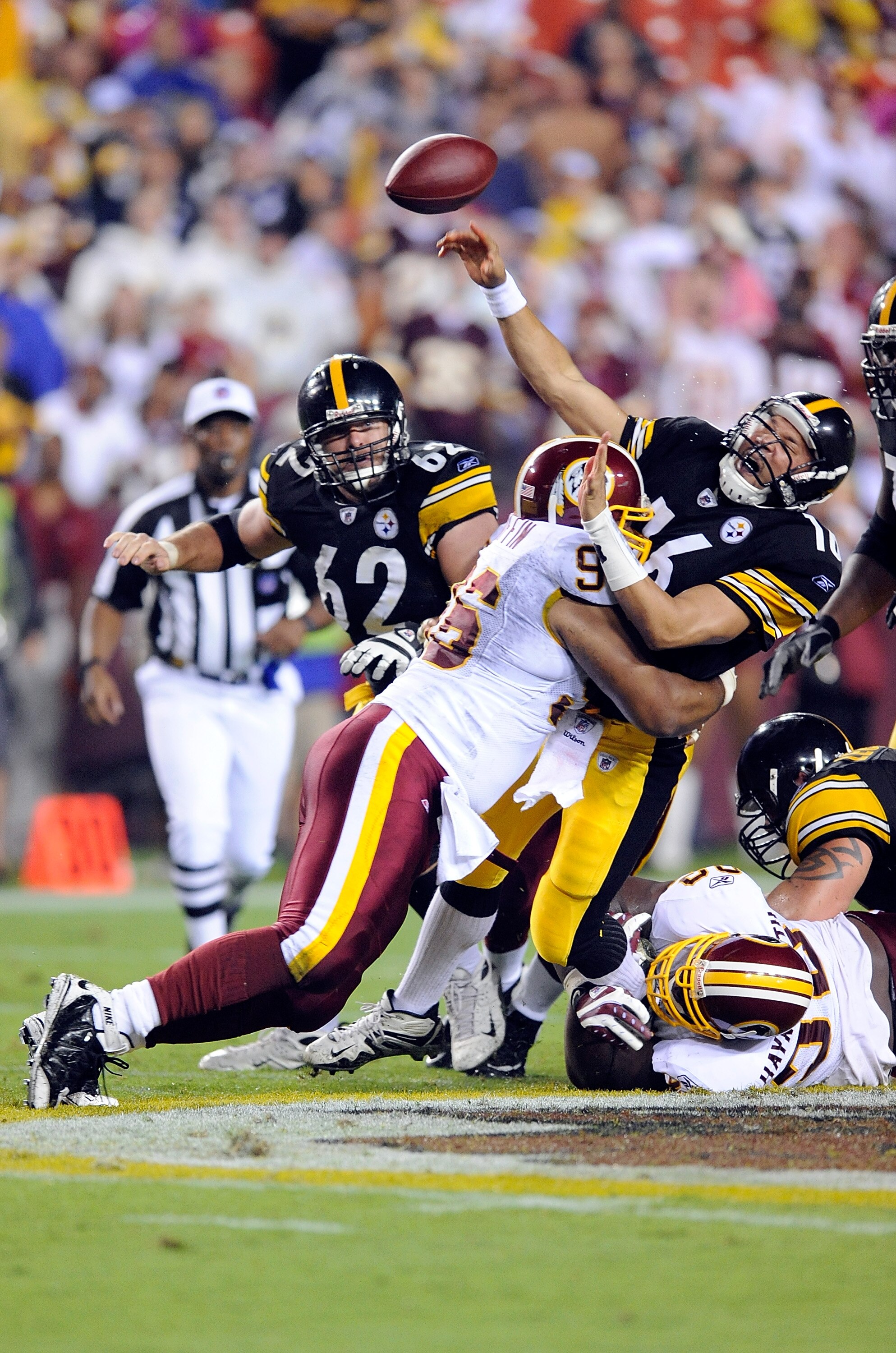 LANDOVER, MD - AUGUST 22:  Charlie Batch #16 of the Pittsburgh Steelers is hit by Cornelius Griffin #96 of the Washington Redskins at Fed Ex Field on August 22, 2009 in Landover, Maryland.  (Photo by Greg Fiume/Getty Images)