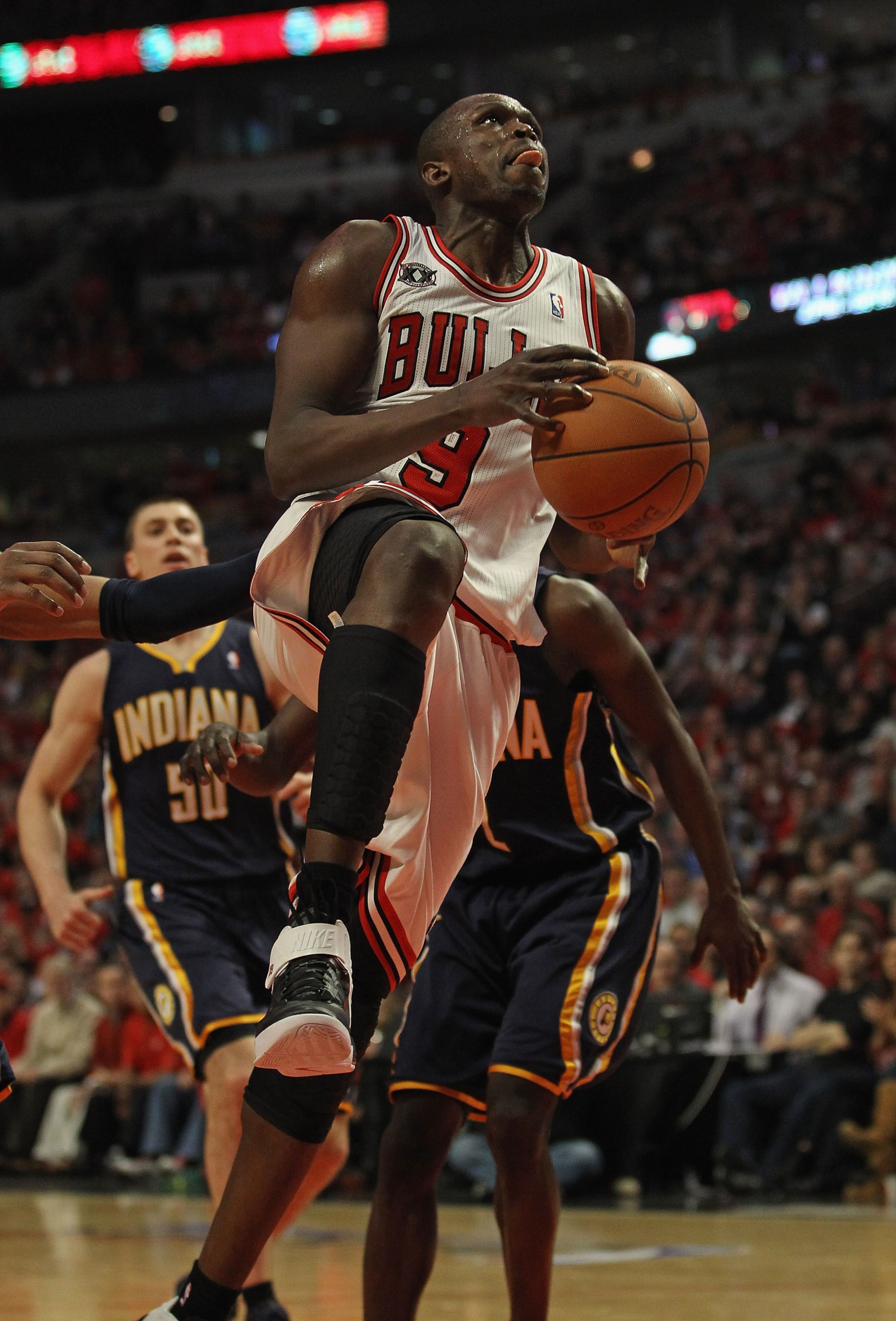 CHICAGO, IL - APRIL 16: Loul Deng #9 of the Chicago Bulls drives to the basket against the Indiana Pacers in Game One of the Eastern Conference Quarterfinals in the 2011 NBA Playoffs at the United Center on April 16, 2011 in Chicago, Illinois. The Bulls d
