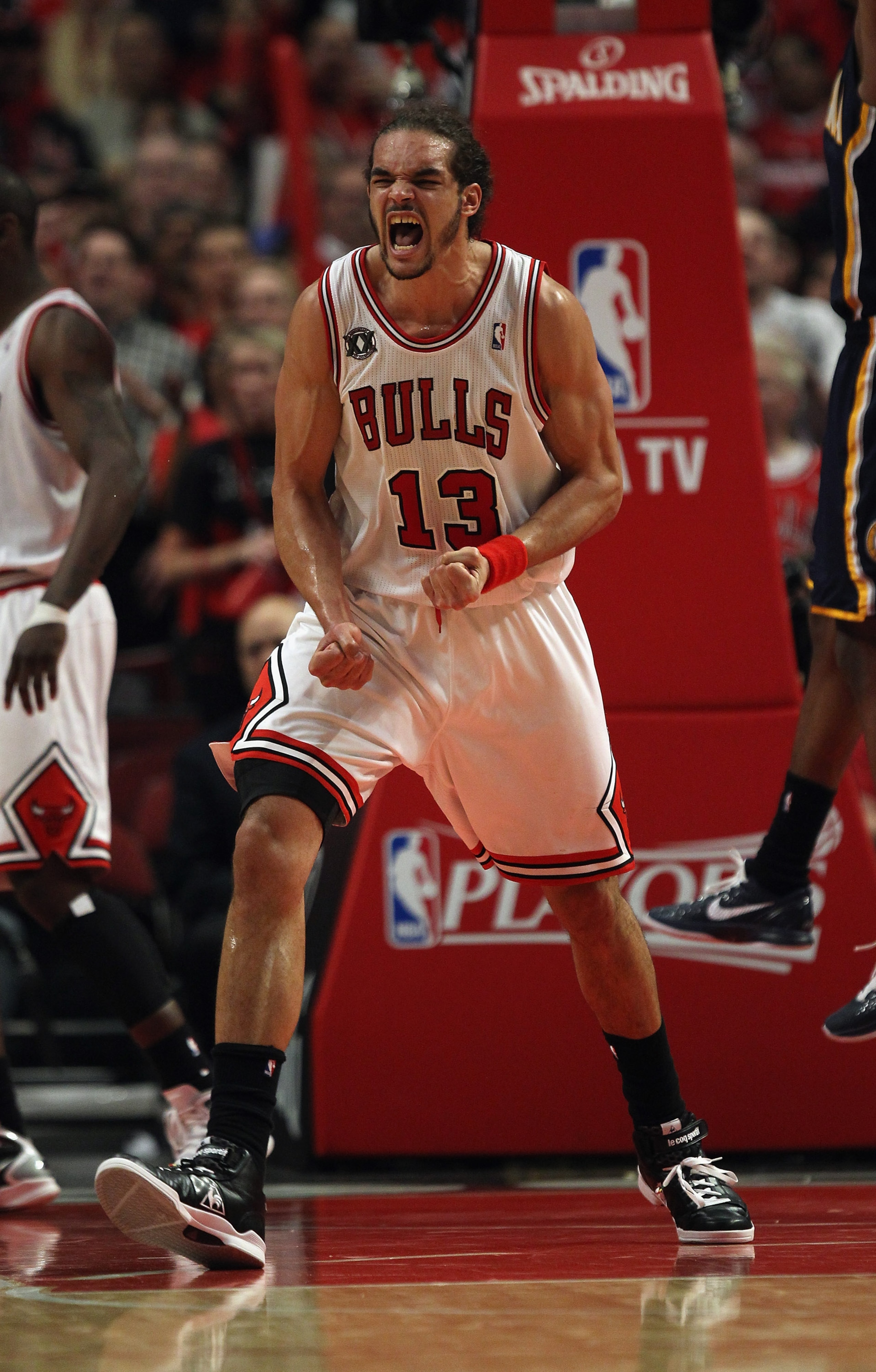 CHICAGO, IL - APRIL 18: Joakim Noah #13 of the Chicago Bulls celebrates a play against the Indiana Pacers in Game Two of the Eastern Conference Quarterfinals in the 2011 NBA Playoffs at the United Center on April 18, 2011 in Chicago, Illinois. The Bulls d