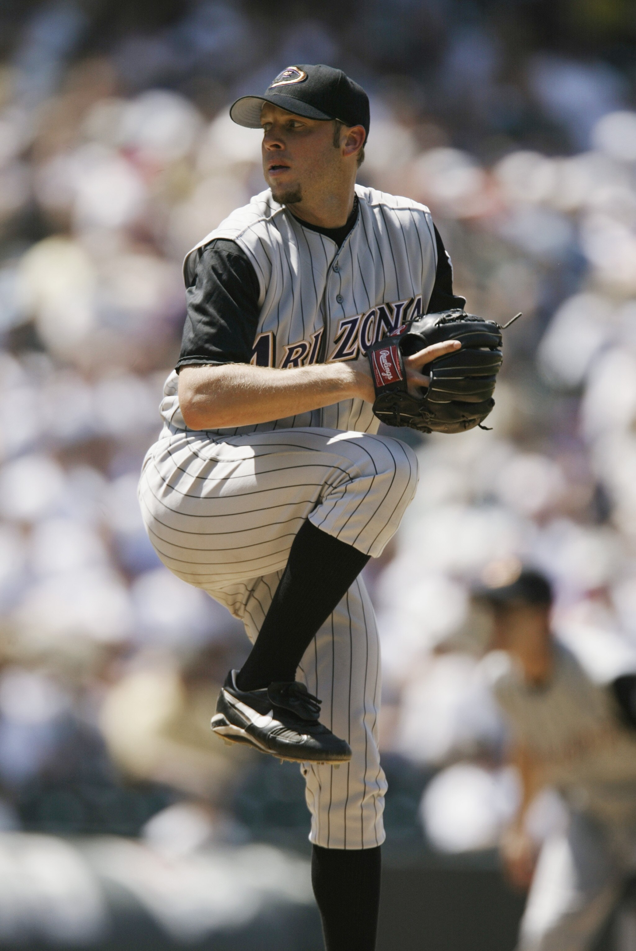 DENVER - JULY 18:  Pitcher Brian Anderson #34 of the Arizona Diamondbacks winds up during the MLB game against the Colorado Rockies on July 18, 2002 at Coors Field in Denver, Colorado.  The Rockies won 6-4.  (Photo by Brian Bahr/Getty Images)