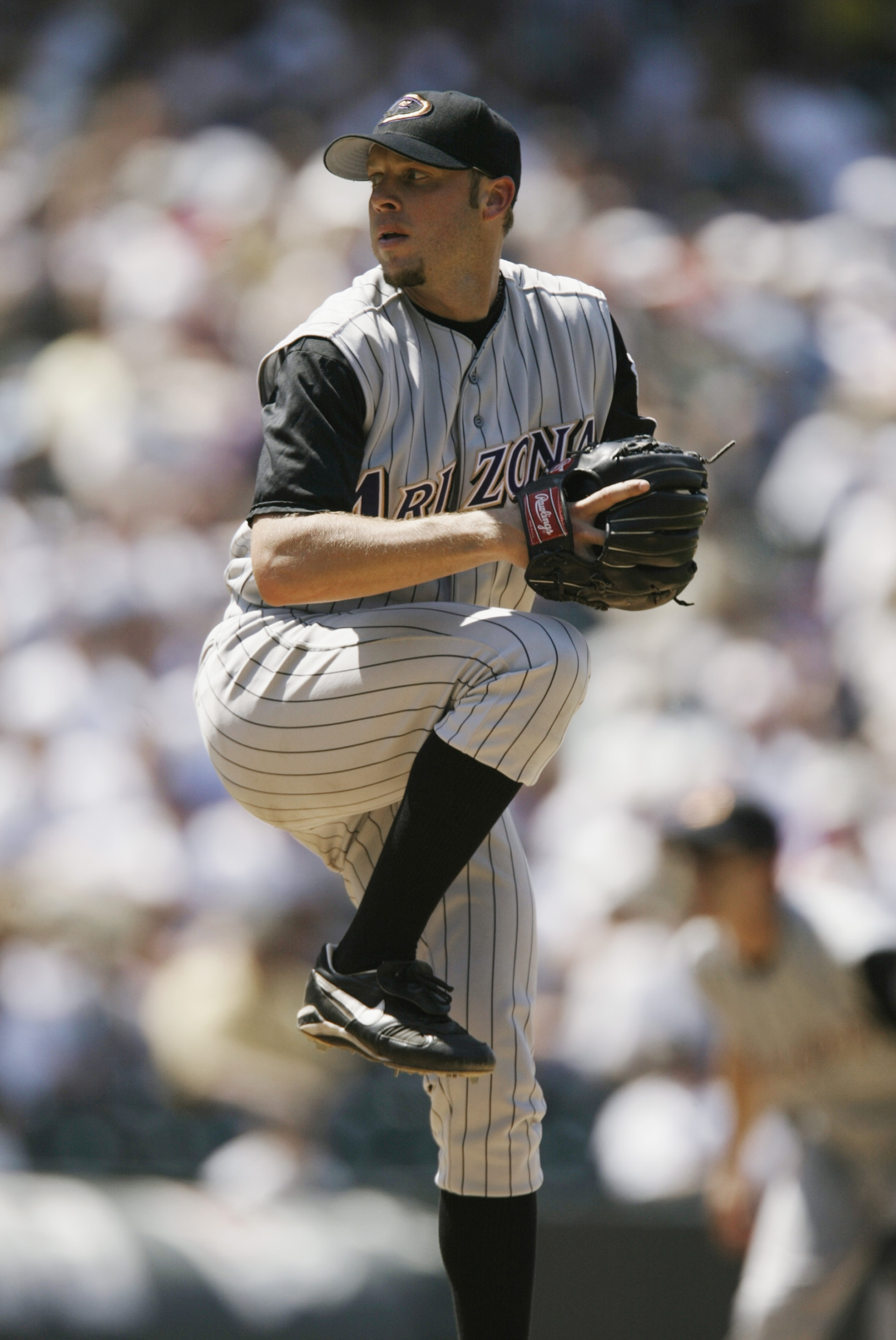 DENVER - JULY 18:  Pitcher Brian Anderson #34 of the Arizona Diamondbacks winds up during the MLB game against the Colorado Rockies on July 18, 2002 at Coors Field in Denver, Colorado.  The Rockies won 6-4.  (Photo by Brian Bahr/Getty Images)