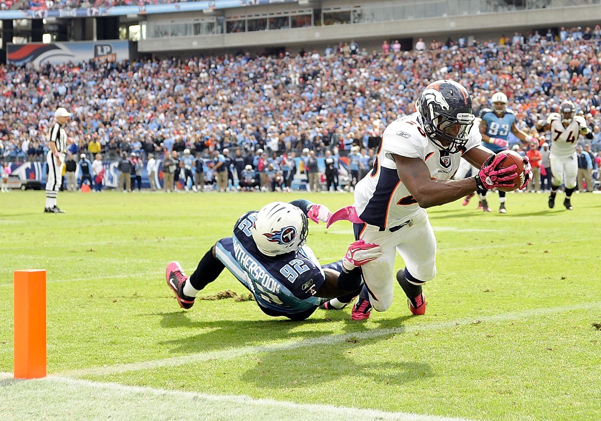 NASHVILLE, TN - OCTOBER 03:  Correll Buckhalter #28 of the Denver Broncos scores the game-winning touchdown against Will Witherspoon #92 of the Tennessee Titans late in the fourth quarter at LP Field on October 3, 2010 in Nashville, Tennessee. Denver won
