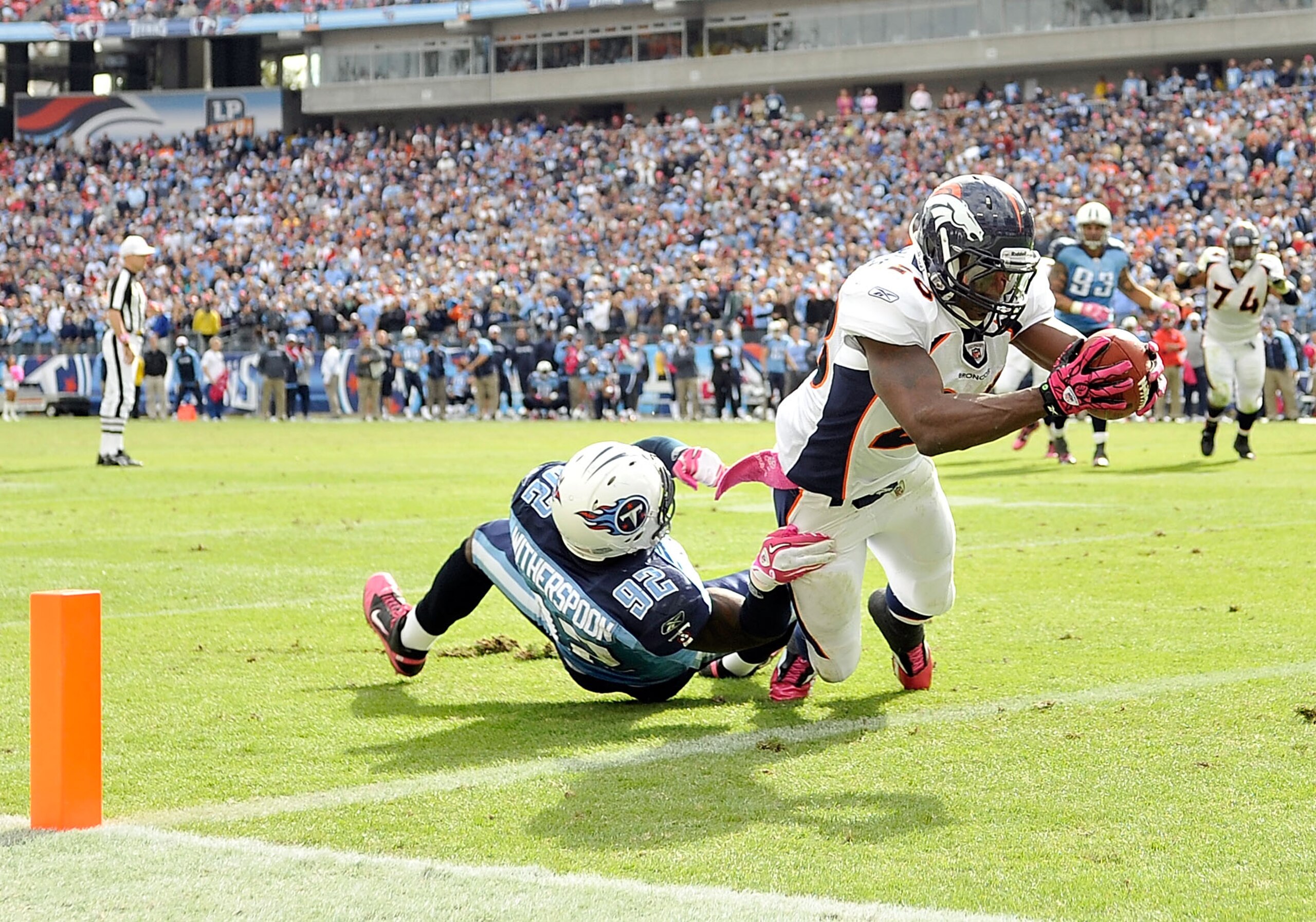 NASHVILLE, TN - OCTOBER 03:  Correll Buckhalter #28 of the Denver Broncos scores the game-winning touchdown against Will Witherspoon #92 of the Tennessee Titans late in the fourth quarter at LP Field on October 3, 2010 in Nashville, Tennessee. Denver won