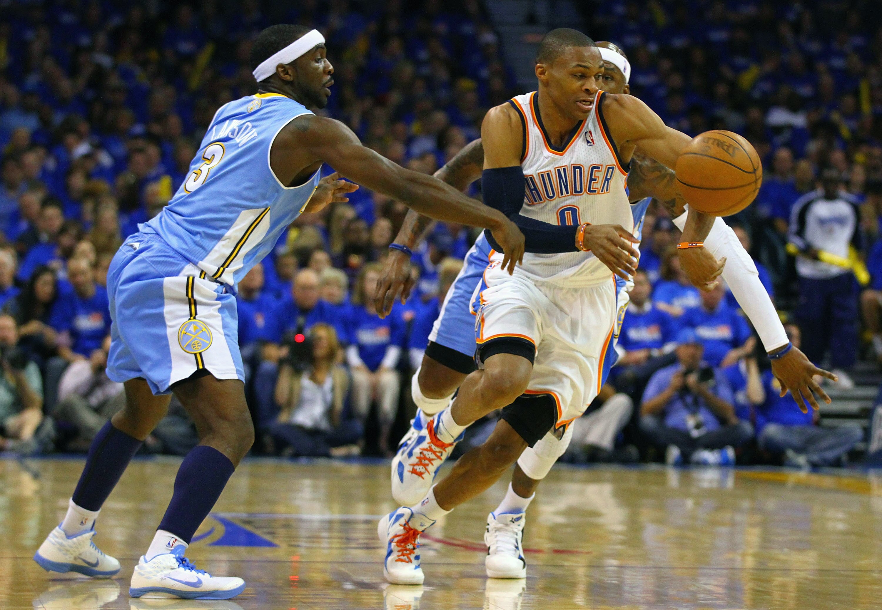OKLAHOMA CITY, OK - APRIL 20: Ty Lawson #3 of the Denver Nuggets knocks the ball away from Russell Westbrook #0 of the Oklahoma City Thunder in Game Two of the Western Conference Quarterfinals in the 2011 NBA Playoffs on April 20, 2011 at the Ford Center