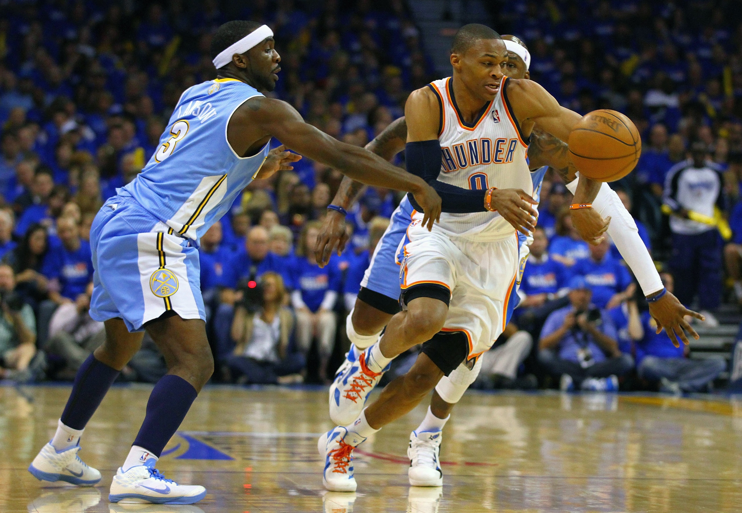 OKLAHOMA CITY, OK - APRIL 20: Ty Lawson #3 of the Denver Nuggets knocks the ball away from Russell Westbrook #0 of the Oklahoma City Thunder in Game Two of the Western Conference Quarterfinals in the 2011 NBA Playoffs on April 20, 2011 at the Ford Center