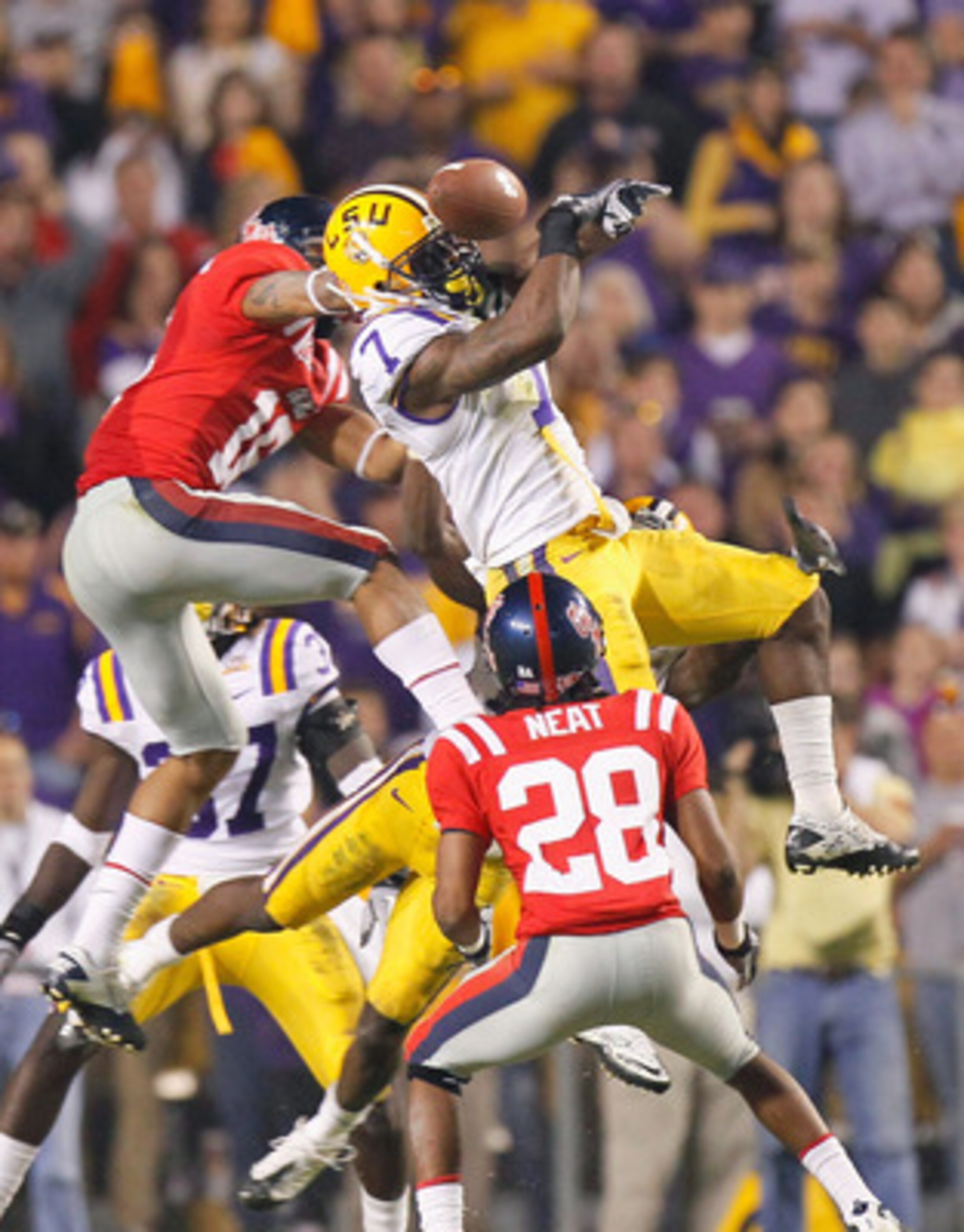 BATON ROUGE, LA - NOVEMBER 20: Patrick Peterson #7 of the Louisiana State University Tigers nearly intercepts a pass in the final seconds against Markeith Summers #16 and Korvic Neat #28 of the Ole Miss Rebels as time expired at Tiger Stadium on November BATON ROUGE, LA - NOVEMBER 20: Patrick Peterson #7 of the Louisiana State University Tigers nearly intercepts a pass in the final seconds against Markeith Summers #16 and Korvic Neat #28 of the Ole Miss Rebels as time expired at Tiger Stadium on November