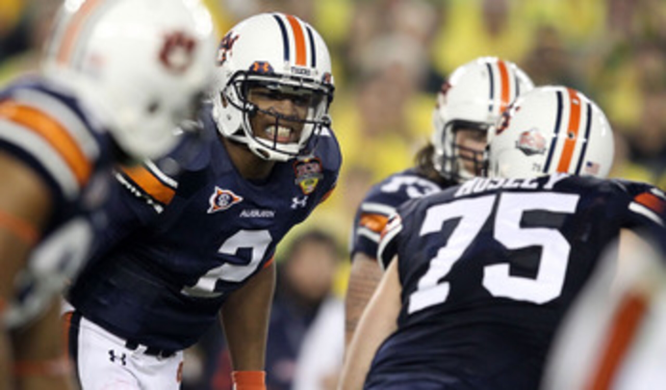 GLENDALE, AZ - JANUARY 10: Cameron Newton #2 of the Auburn Tigersc reacts with his team against the Oregon Ducks during the Tostitos BCS National Championship Game at University of Phoenix Stadium on January 10, 2011 in Glendale, Arizona. (Photo by Chri GLENDALE, AZ - JANUARY 10: Cameron Newton #2 of the Auburn Tigersc reacts with his team against the Oregon Ducks during the Tostitos BCS National Championship Game at University of Phoenix Stadium on January 10, 2011 in Glendale, Arizona. (Photo by Chri