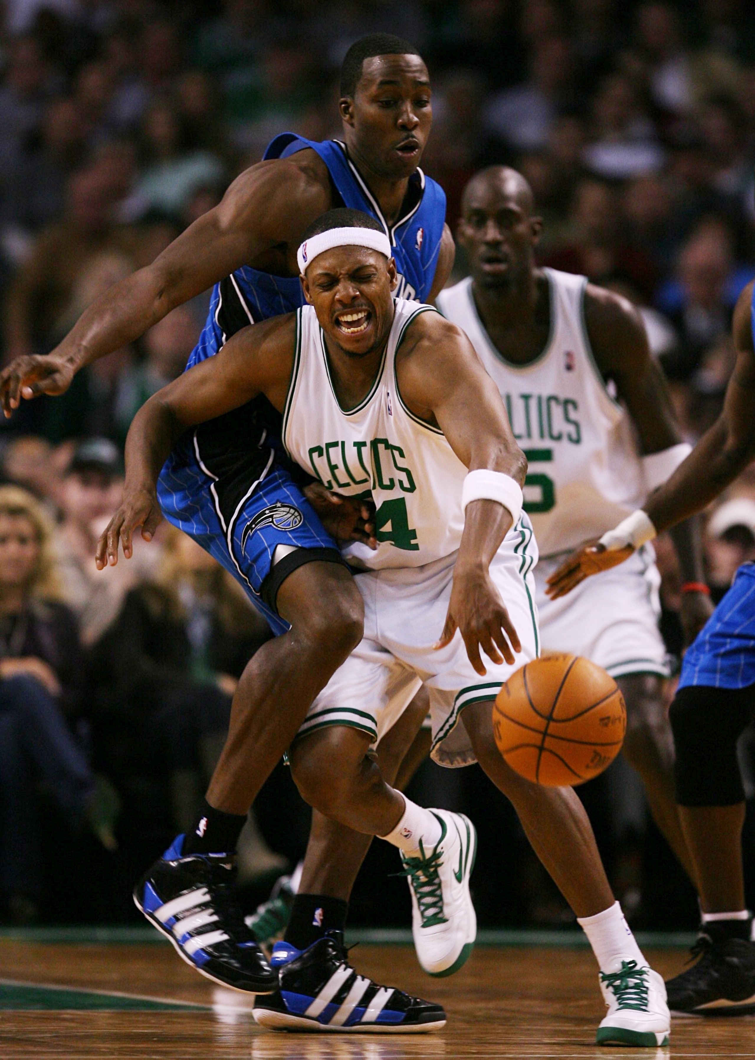 BOSTON - NOVEMBER 20: Paul Pierce #34 of the Boston Celtics tries to move the ball against the defense of Dwight Howard #12 of the Orlando Magic during the game on November 20, 2009 at the TD Garden in Boston, Massachusetts. NOTE TO USER: User expressly a