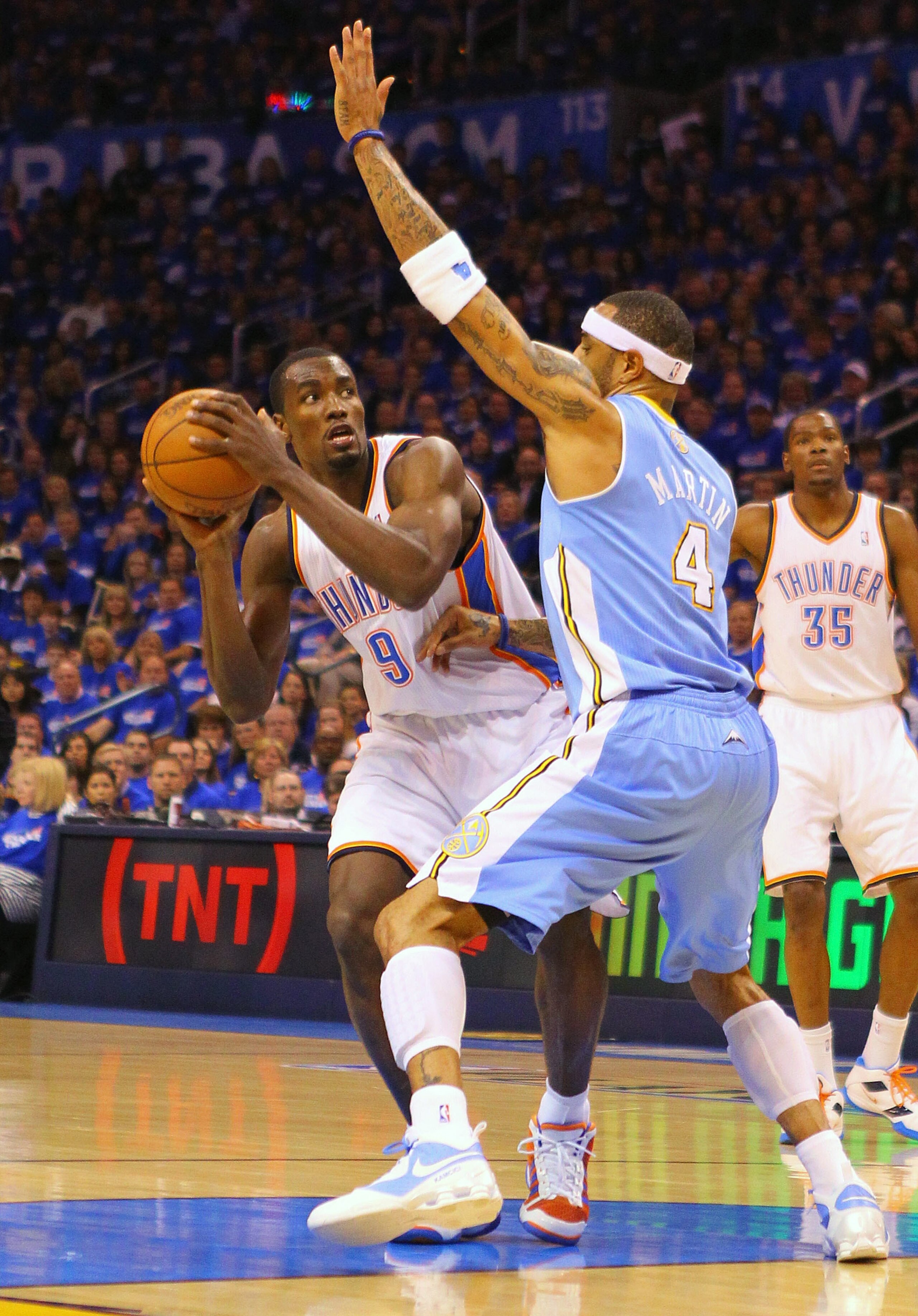 OKLAHOMA CITY, OK - APRIL 20: Serge Ibaka #9 of the Oklahoma City Thunder looks to get past Kenyon Martin #4 of the Denver Nuggets in Game Two of the Western Conference Quarterfinals in the 2011 NBA Playoffs on April 20, 2011 at the Ford Center in Oklahom