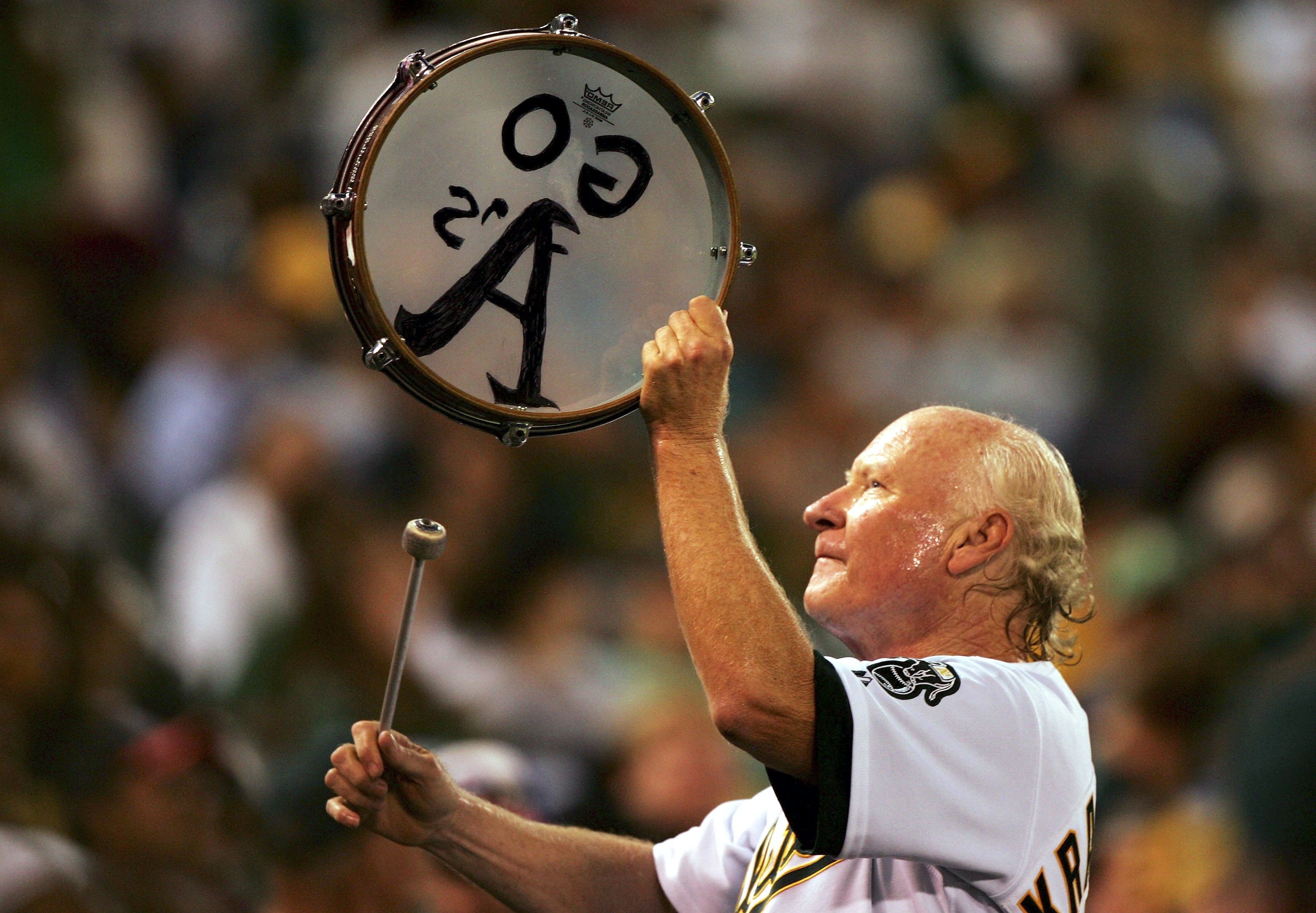 OAKLAND, CA - SEPTEMBER 22:  A's fan 'Krazy' George Henderson cheers during the Los Angeles Angels of Anaheim and Oakland Athletics MLB game at McAfee Coliseum on September 22, 2006 in Oakland, California.  (Photo by Jed Jacobsohn/Getty Images)