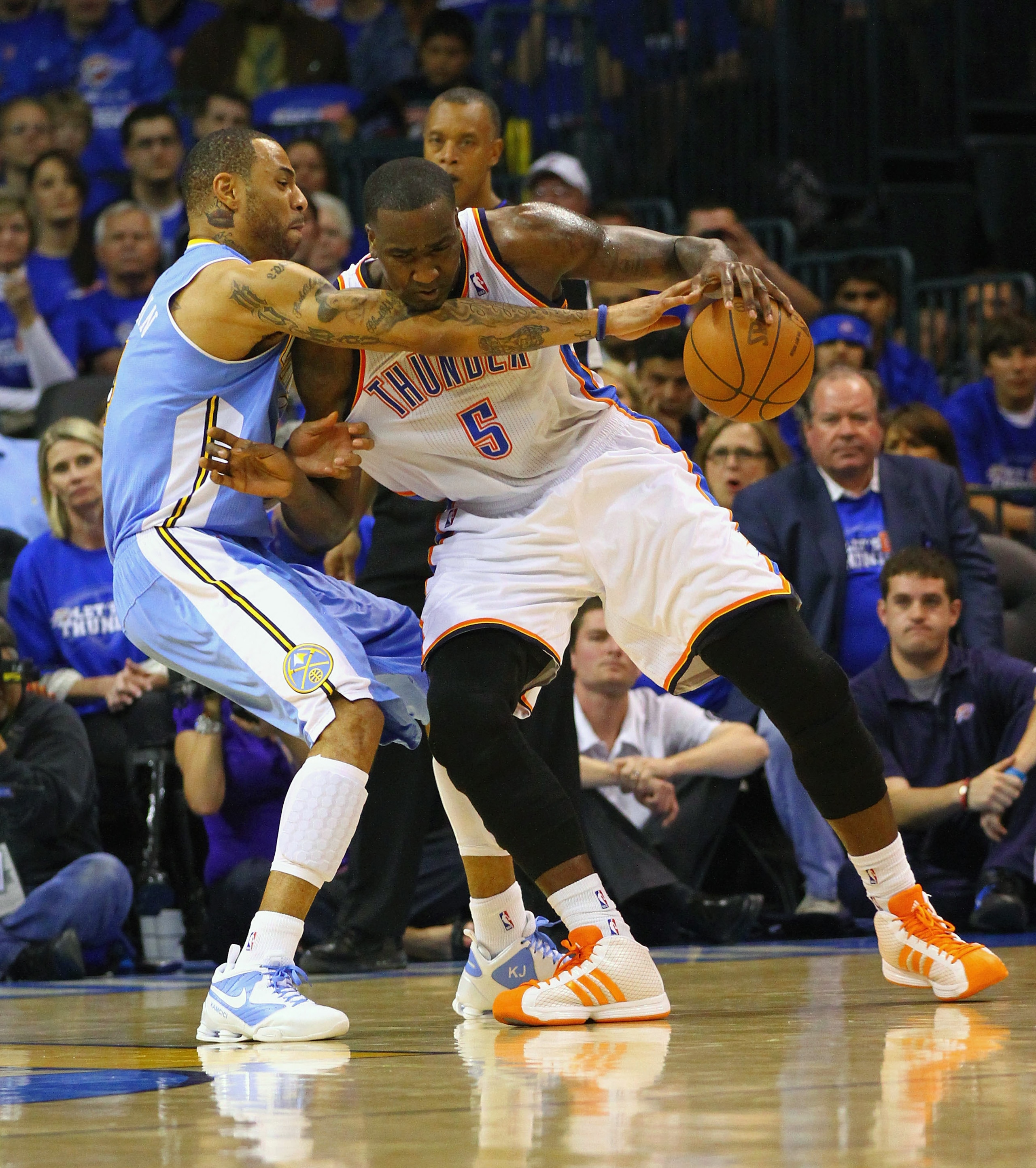 OKLAHOMA CITY, OK - APRIL 20: Kenyon Martin #4 of the Denver Nuggets defends against Kendrick Perkins #5 of the Oklahoma City Thunder in Game Two of the Western Conference Quarterfinals in the 2011 NBA Playoffs on April 20, 2011 at the Ford Center in Okla