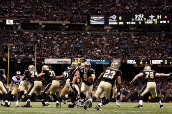 NEW ORLEANS, LA - DECEMBER 12:  Drew Brees #9 of the New Orleans Saints looks to hand the ball off during the game against the St. Louis Rams at the Louisiana Superdome on December 12, 2010 in New Orleans, Louisiana. The Saints defeated the Rams 31-13.  (
