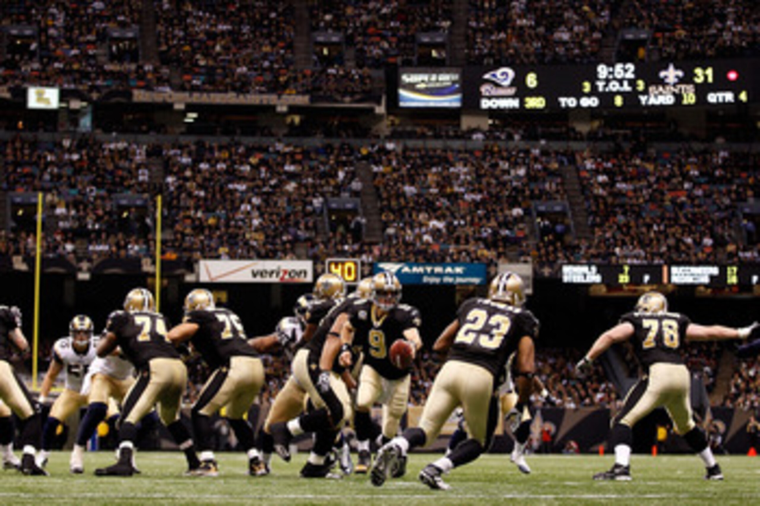 NEW ORLEANS, LA - DECEMBER 12:  Drew Brees #9 of the New Orleans Saints looks to hand the ball off during the game against the St. Louis Rams at the Louisiana Superdome on December 12, 2010 in New Orleans, Louisiana. The Saints defeated the Rams 31-13.  (