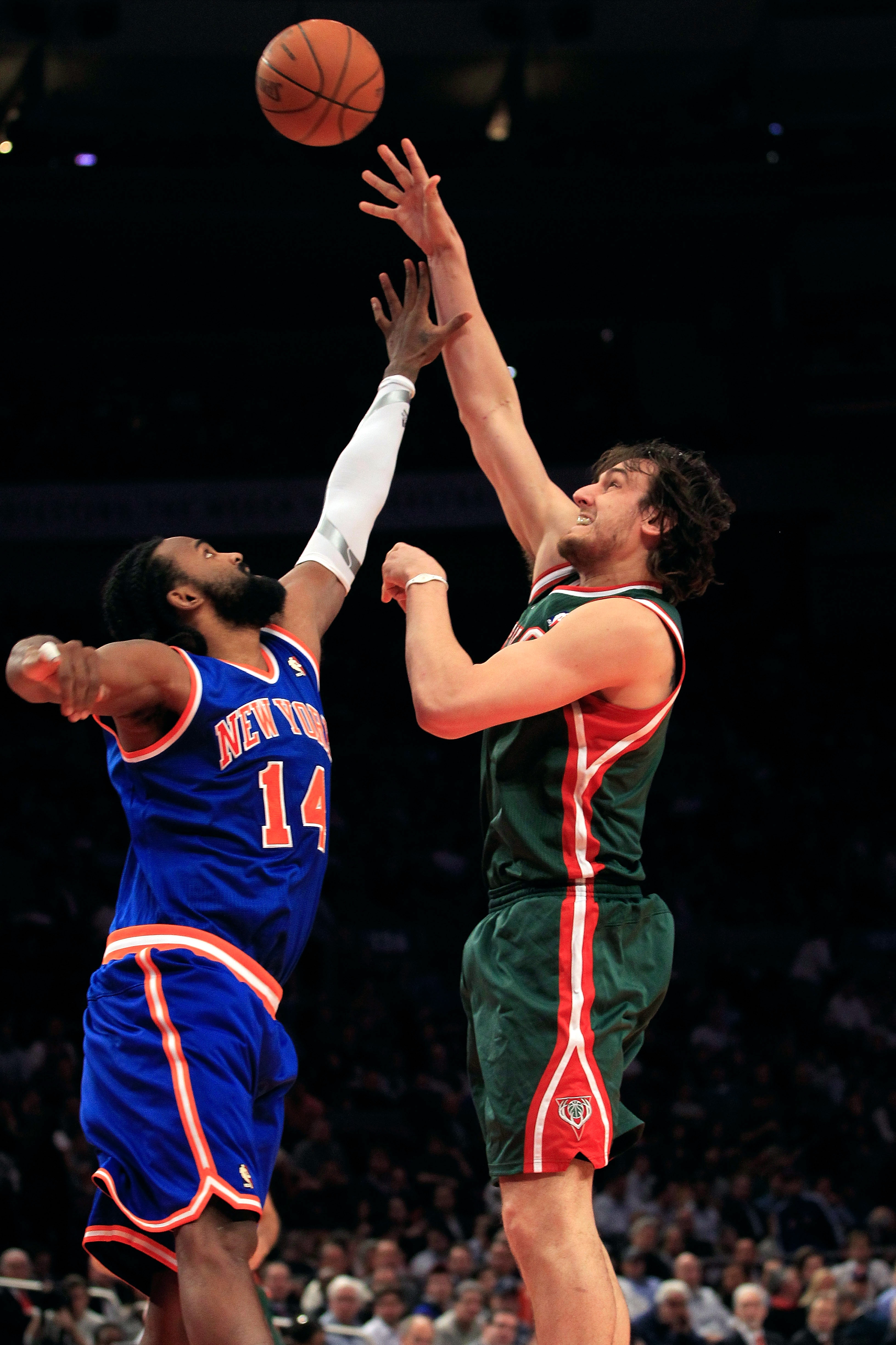 NEW YORK, NY - FEBRUARY 23:  Andrew Bogut #6 of the Milwaukee Bucks shoots the ball over Ronny Turiaf #14 of the New York Knicks at Madison Square Garden on February 23, 2011 in New York City. NOTE TO USER: User expressly acknowledges and agrees that, by 