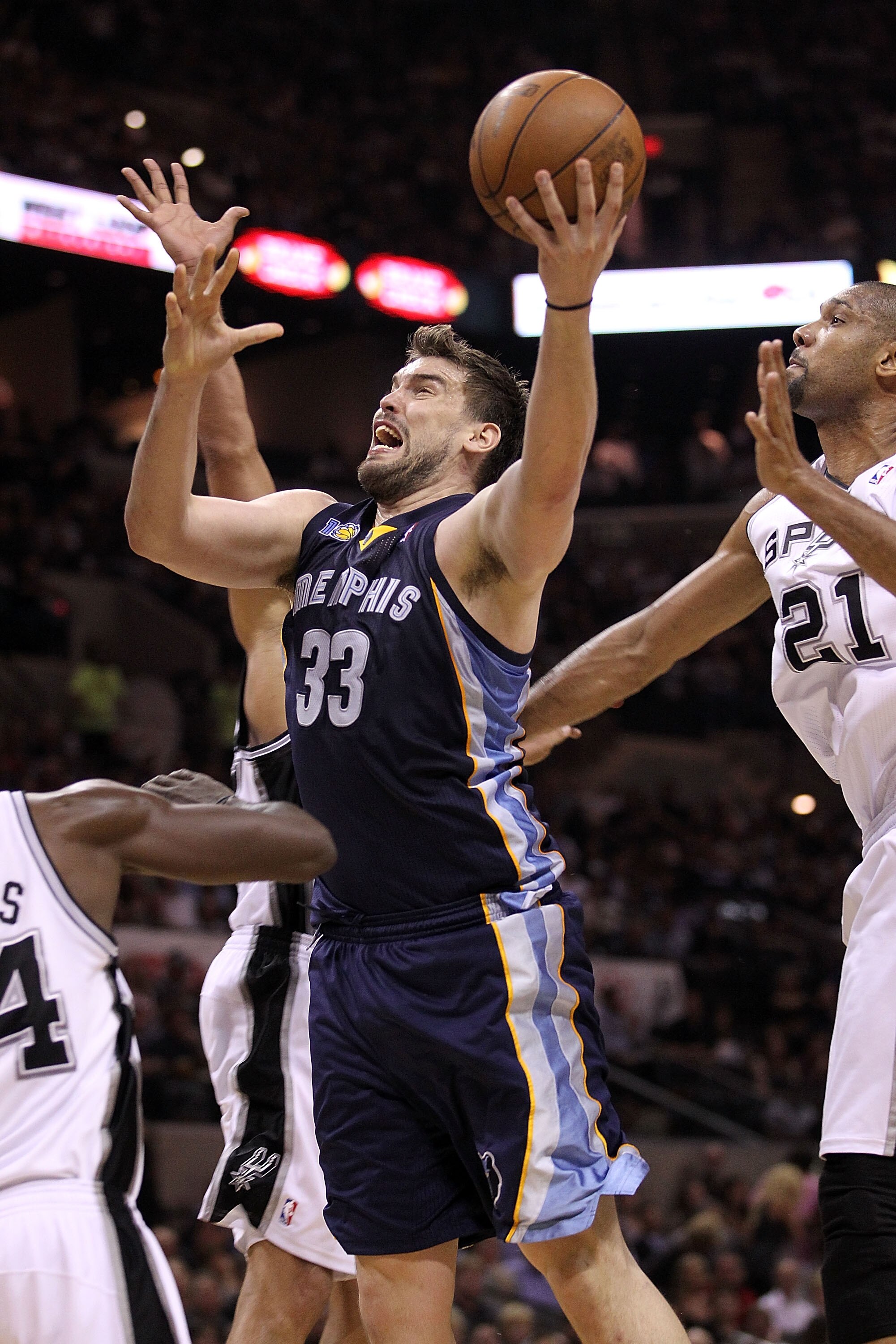 SAN ANTONIO, TX - APRIL 20:  Center Marc Gasol #33 of the Memphis Grizzlies takes a shot against Antonio McDyess #34 of the San Antonio Spurs in Game Two of the Western Conference Quarterfinals in the 2011 NBA Playoffs on April 20, 2011 at AT&T Center in 