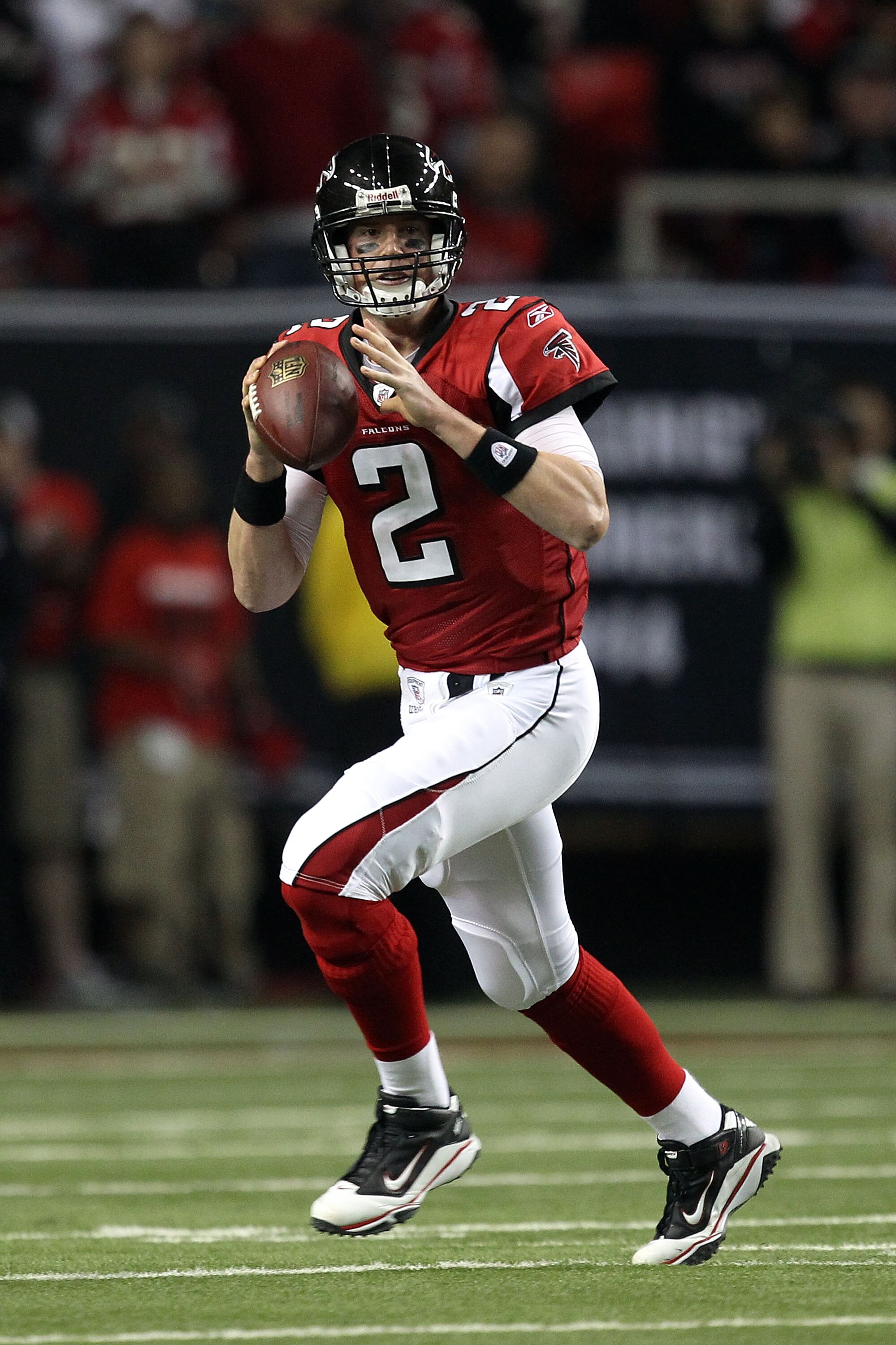 ATLANTA, GA - JANUARY 15:  Quarterback Matt Ryan #2 of the Atlanta Falcons rolls out to pass against the Green Bay Packers during their 2011 NFC divisional playoff game at Georgia Dome on January 15, 2011 in Atlanta, Georgia. The Packers won 48-21.  (Phot