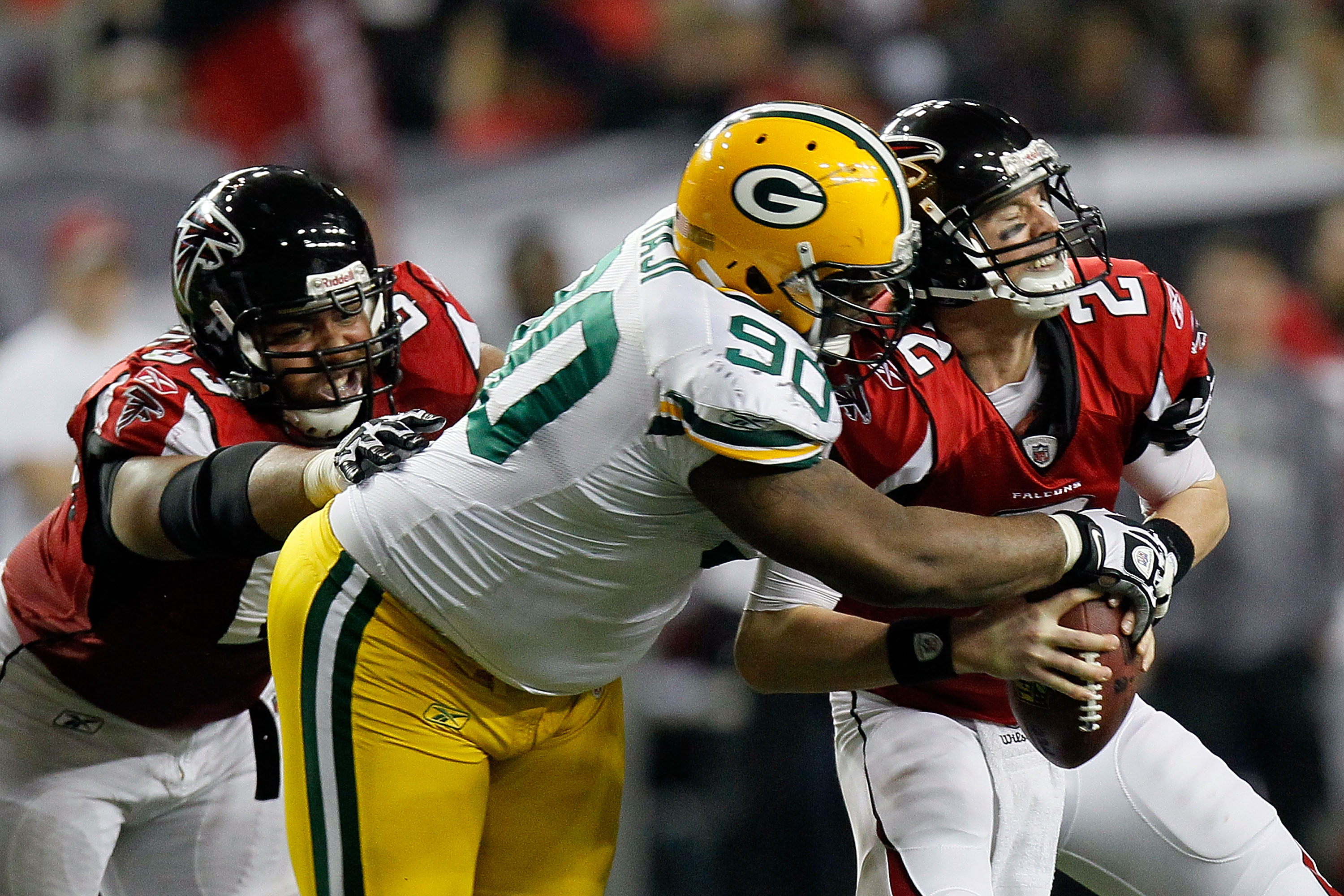 ATLANTA, GA - JANUARY 15:  B.J. Raji #90 of the Green Bay Packers sacks Matt Ryan #2 of the Atlanta Falcons during their 2011 NFC divisional playoff game at Georgia Dome on January 15, 2011 in Atlanta, Georgia.  (Photo by Kevin C. Cox/Getty Images)