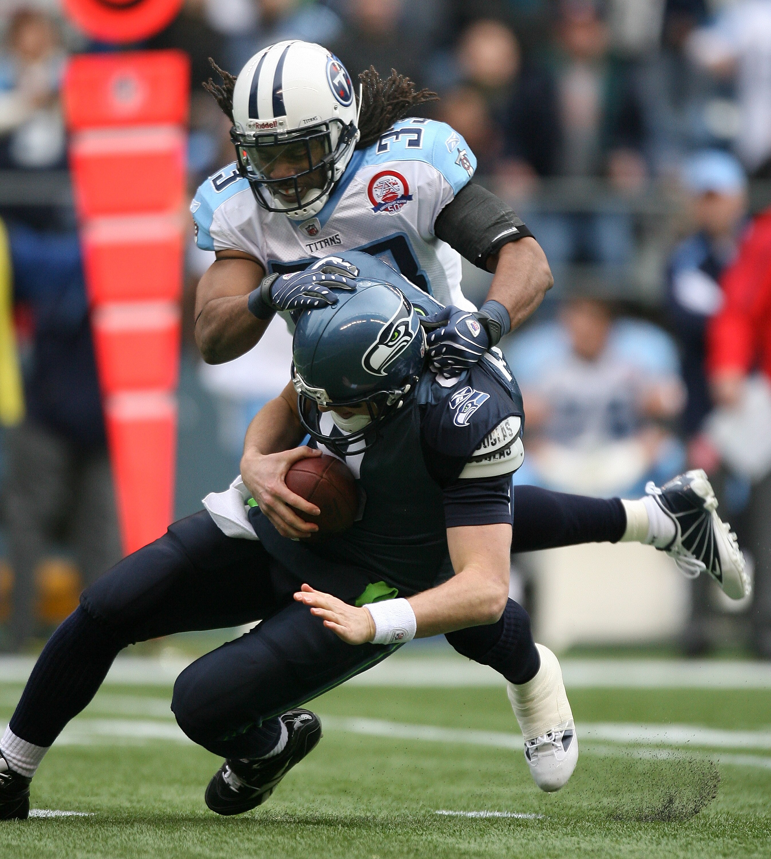 SEATTLE - JANUARY 03:  Quarterback Matt Hasselbeck #8 of the Seattle Seahawks is sacked by Michael Griffin #33 of the Tennessee Titans on January 3, 2010 at Qwest Field in Seattle, Washington. (Photo by Otto Greule Jr/Getty Images)