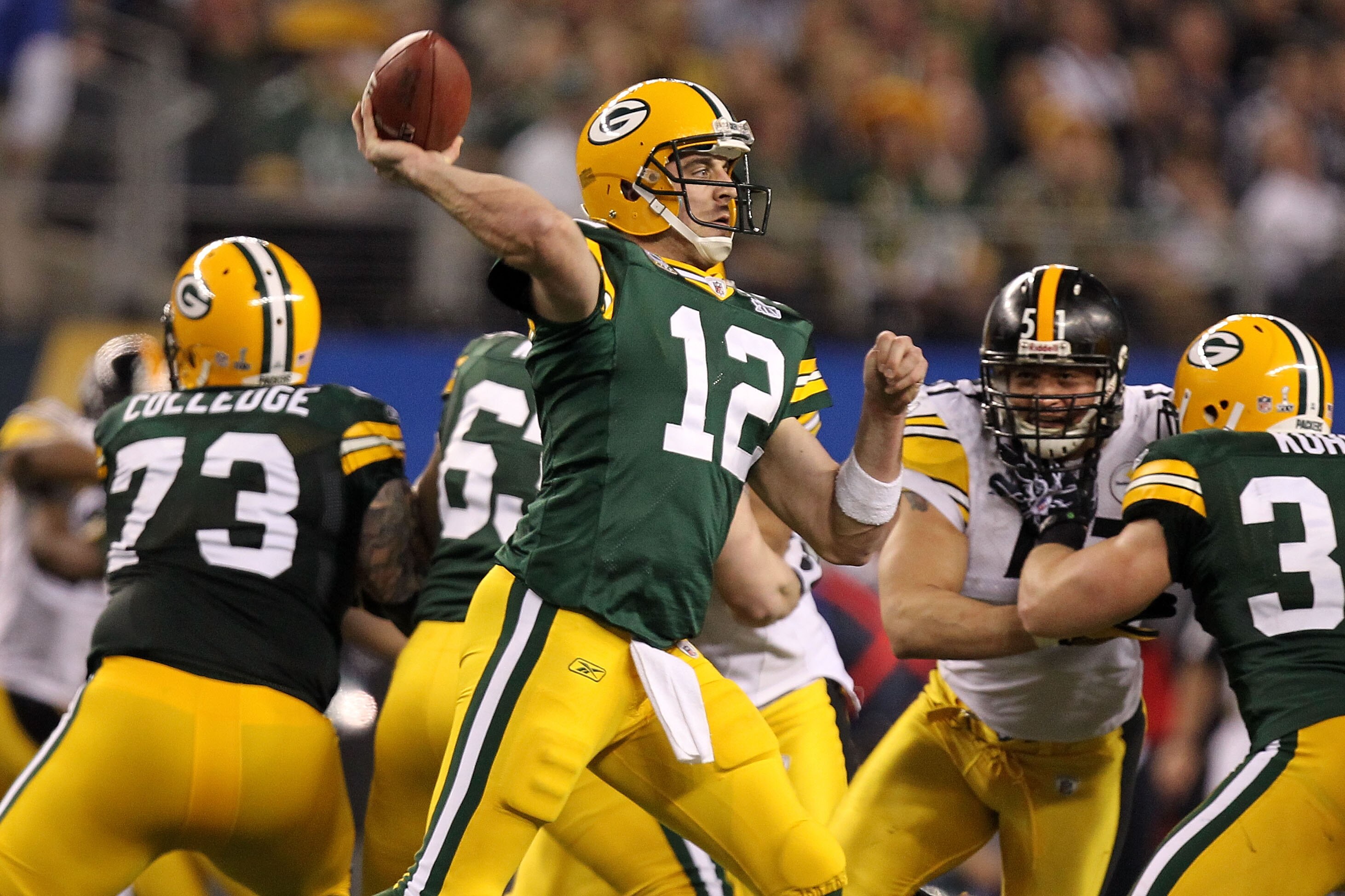 ARLINGTON, TX - FEBRUARY 06:  Aaron Rodgers #12 of the Green Bay Packers throws a pass against the Pittsburgh Steelers during Super Bowl XLV at Cowboys Stadium on February 6, 2011 in Arlington, Texas.  (Photo by Ronald Martinez/Getty Images)