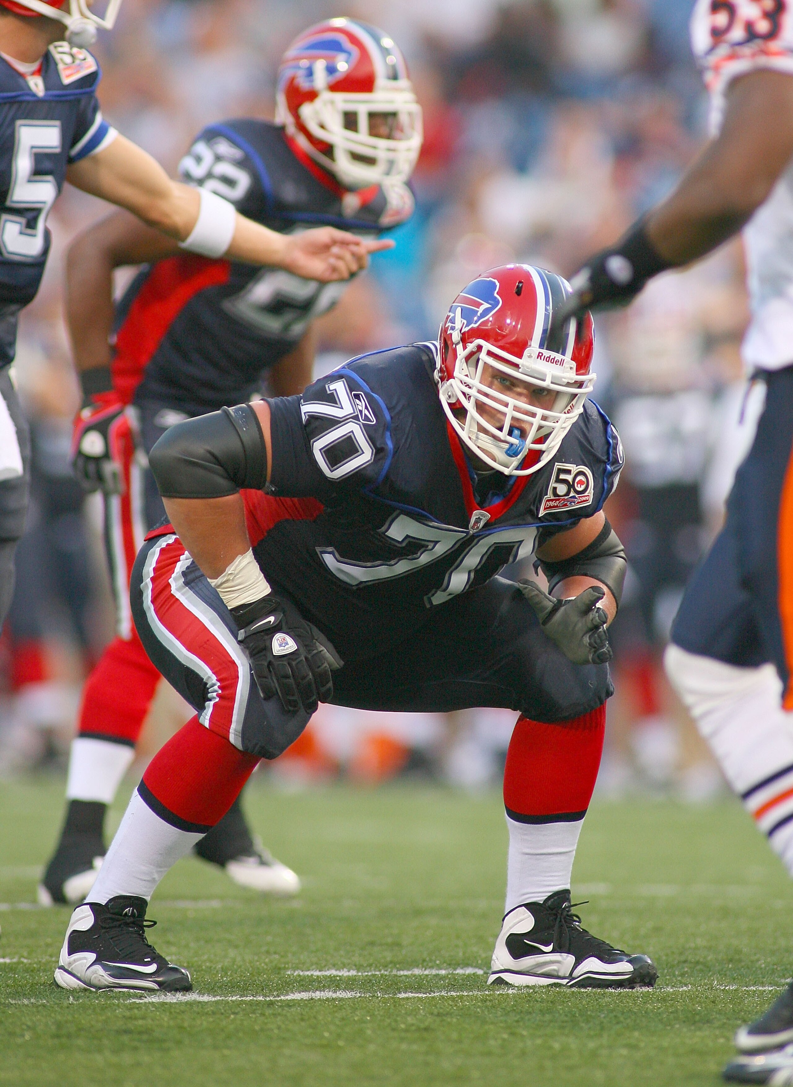 ORCHARD PARK, NY - AUGUST 15: Eric Wood #70  of the Buffalo Bills readies for a play against the Chicago Bears on August 15, 2009 at Ralph Wilson Stadium in Orchard Park, New York.  (Photo by Rick Stewart/Getty Images)