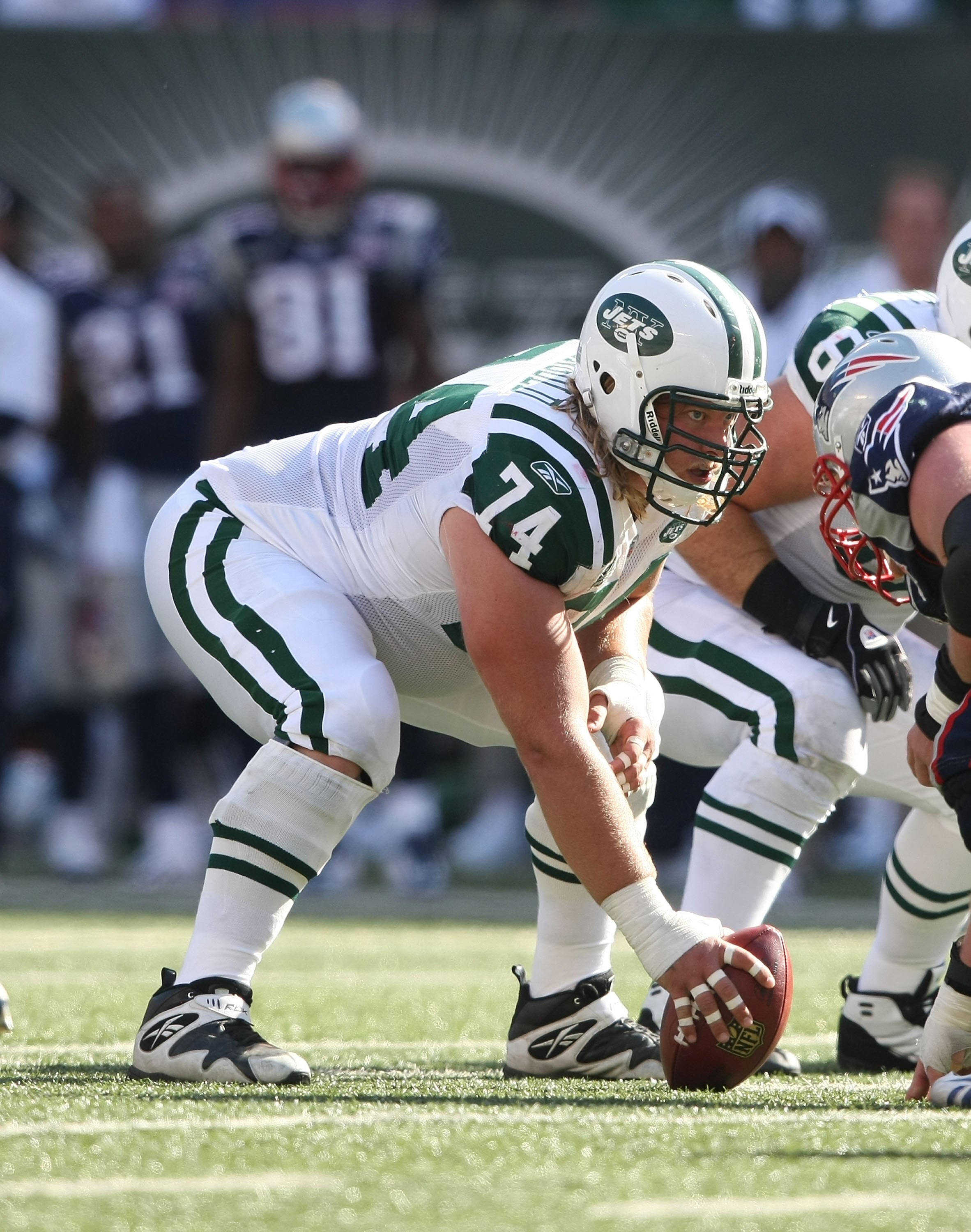 EAST RUTHERFORD, NJ - SEPTEMBER 20:  Nick Mangold #74 of the New York Jets waits to snap against the New England Patriots at Giants Stadium on September 20, 2009 in East Rutherford, New Jersey.  (Photo by Nick Laham/Getty Images)