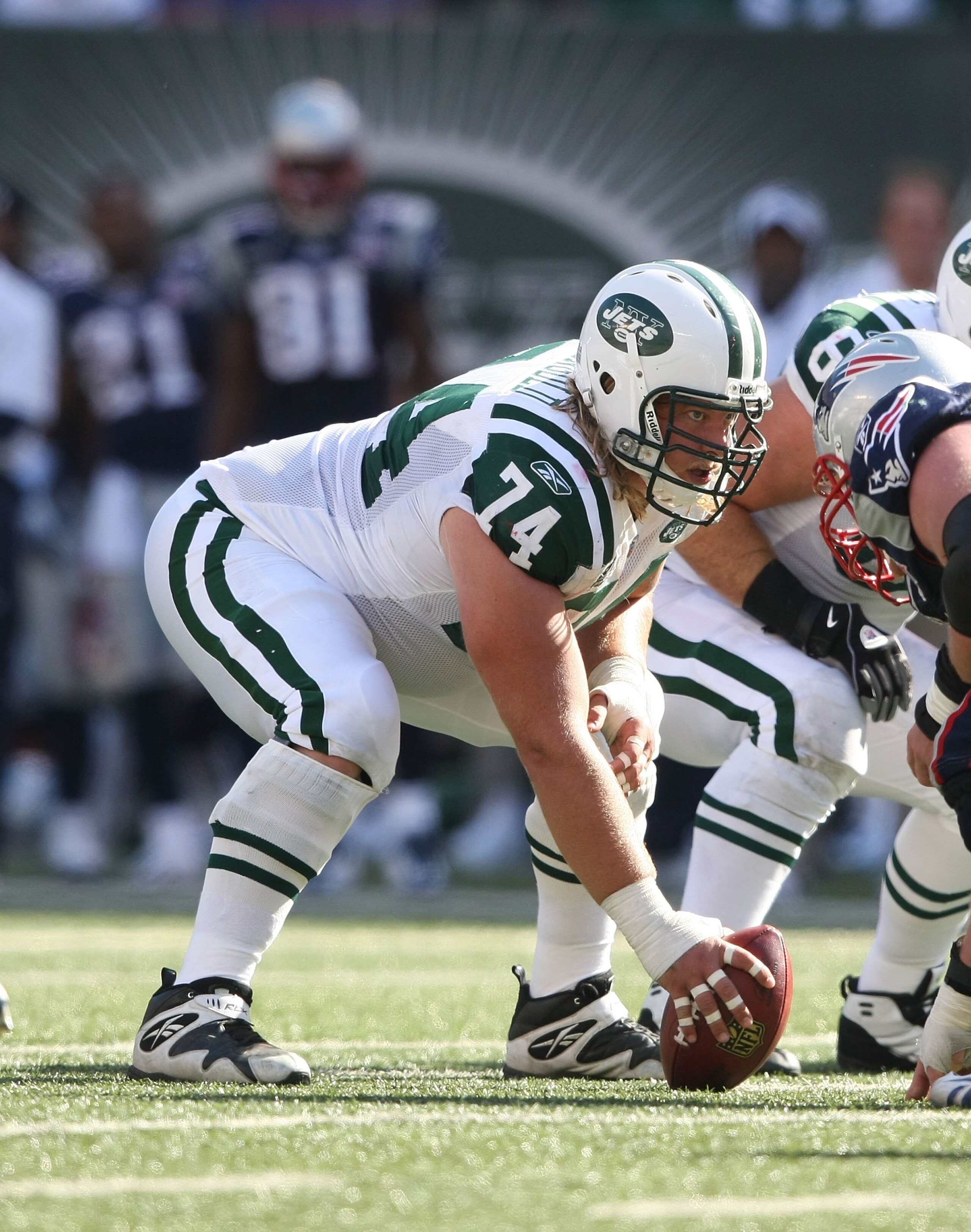 EAST RUTHERFORD, NJ - SEPTEMBER 20:  Nick Mangold #74 of the New York Jets waits to snap against the New England Patriots at Giants Stadium on September 20, 2009 in East Rutherford, New Jersey.  (Photo by Nick Laham/Getty Images)