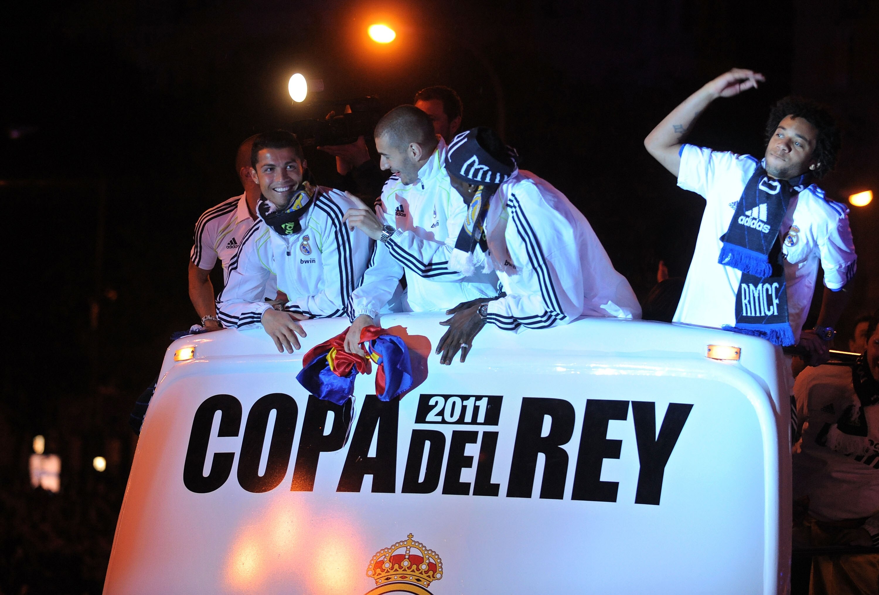 MADRID, SPAIN - APRIL 21:  Cristiano Ronaldo (L) Karim Benzema and Marcelo (R) of Real Madrid celebrate from an open bus at Plaza Cibeles on April 21, 2011 in Madrid, Spain. Real beat Barcelona 1-0 in the Copa del Rey final in Valencia's Mestalla stadium