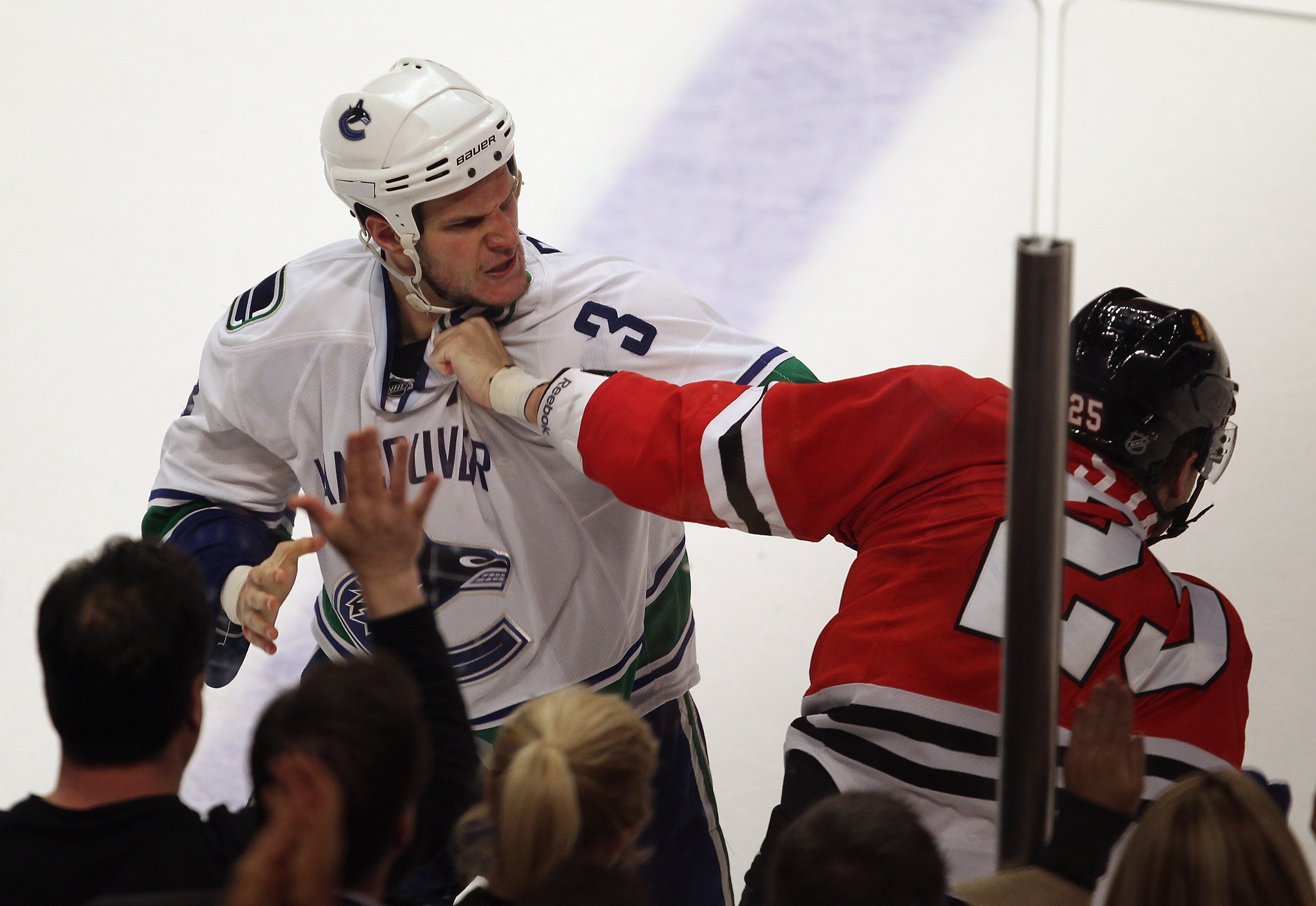 CHICAGO, IL - APRIL 19: Viktor Stalberg #25 of the Chicago Blackhawks fights with Kevin Bieksa #3 of the Vancouver Canucks in Game Four of the Western Conference Quarterfinals during the 2011 NHL Stanley Cup Playoffs at the United Center on April 19, 2011 CHICAGO, IL - APRIL 19: Viktor Stalberg #25 of the Chicago Blackhawks fights with Kevin Bieksa #3 of the Vancouver Canucks in Game Four of the Western Conference Quarterfinals during the 2011 NHL Stanley Cup Playoffs at the United Center on April 19, 2011