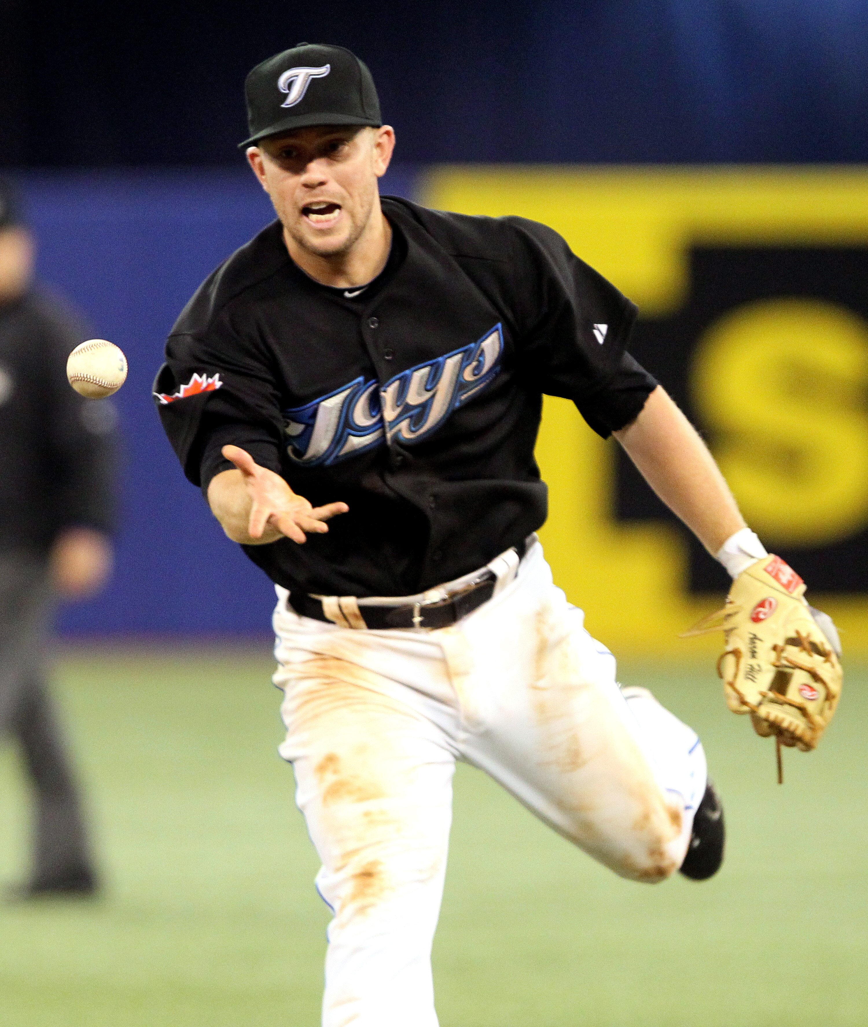 TORONTO, CANADA - APRIL 7: Aaron Hill #2 of the Toronto Blue Jays throws to first during MLB action between the Toronto Blue Jays and the Oakland Athletics at the Rogers Centre April 7, 2011 in Toronto, Ontario, Canada. (Photo by Abelimages/Getty Images)