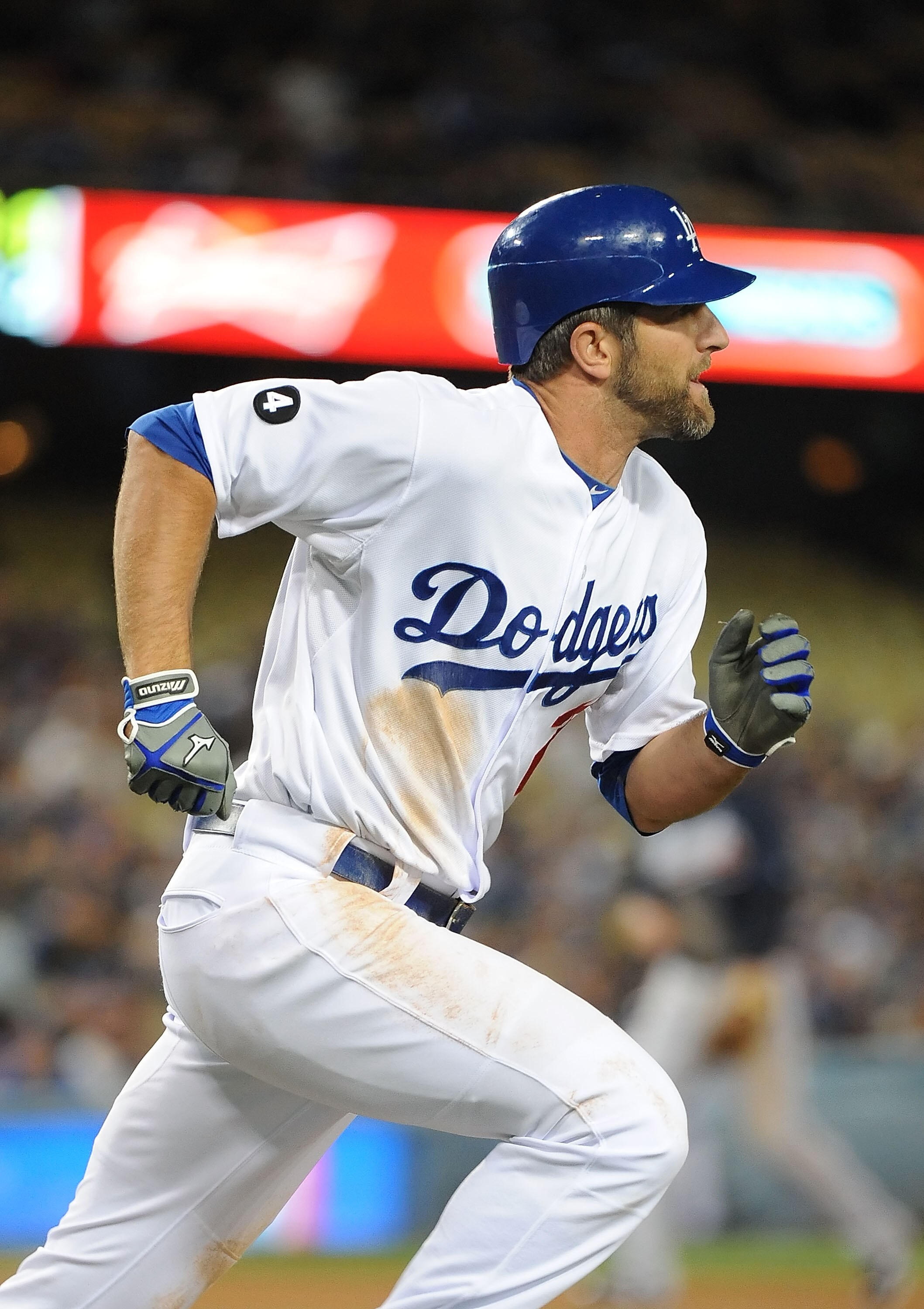 LOS ANGELES, CA - APRIL 20:  Casey Blake #23 of the Los Angeles Dodgers runs to first base after hitting a single in the second inning against the Atlanta Braves at Dodger Stadium on April 20, 2011 in Los Angeles, California.  (Photo by Lisa Blumenfeld/Ge