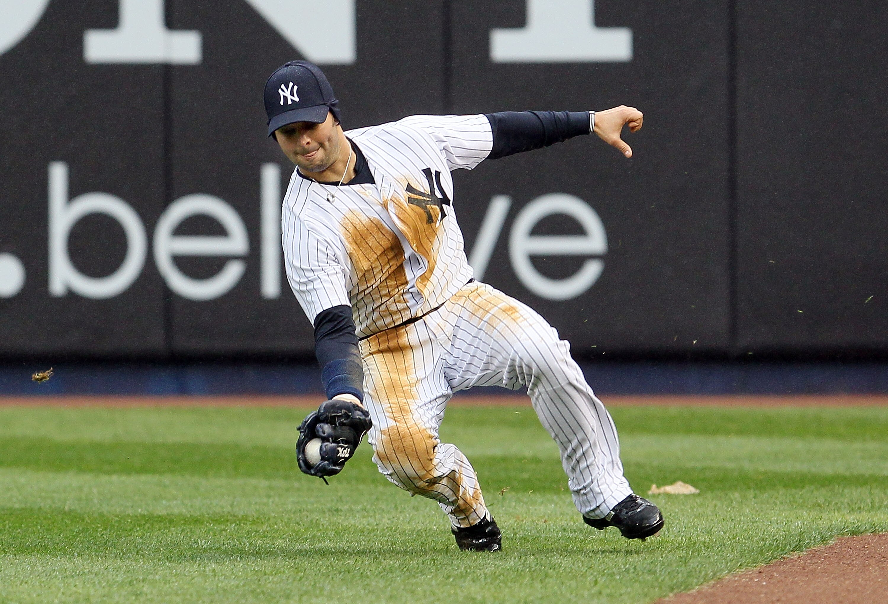 NEW YORK, NY - APRIL 16:  Nick Swisher #33 of the New York Yankees makes a catch in the fifth inning against the Texas Rangers on April 16, 2011 at Yankee Stadium in the Bronx borough of New York City.  (Photo by Jim McIsaac/Getty Images)