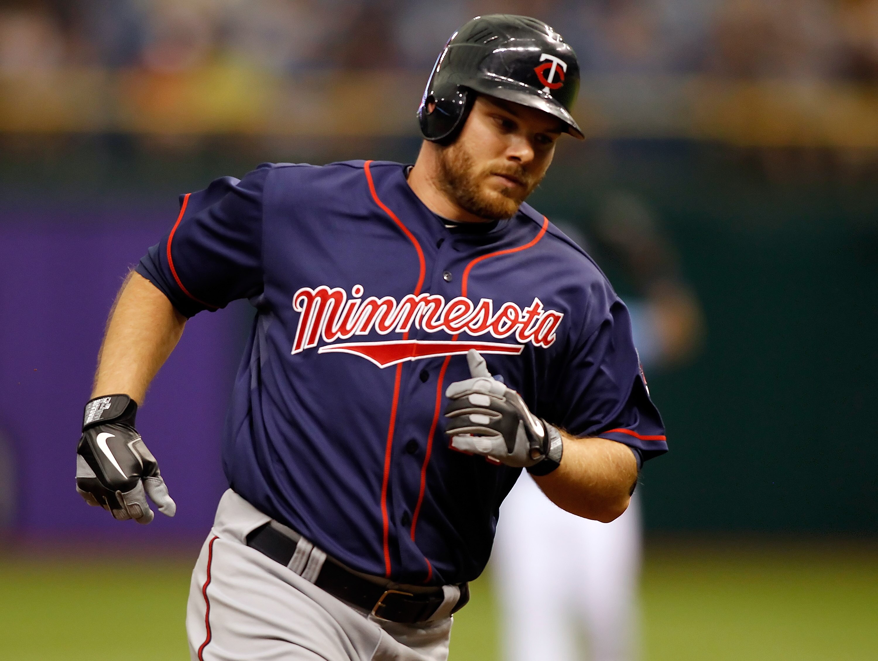 ST. PETERSBURG, FL - APRIL 17:  Outfielder Jason Kubel #16 of the Minnesota Twins rounds the bases after his fourth inning home run against the Tampa Bay Rays during the game at Tropicana Field on April 17, 2011 in St. Petersburg, Florida.  (Photo by J. M