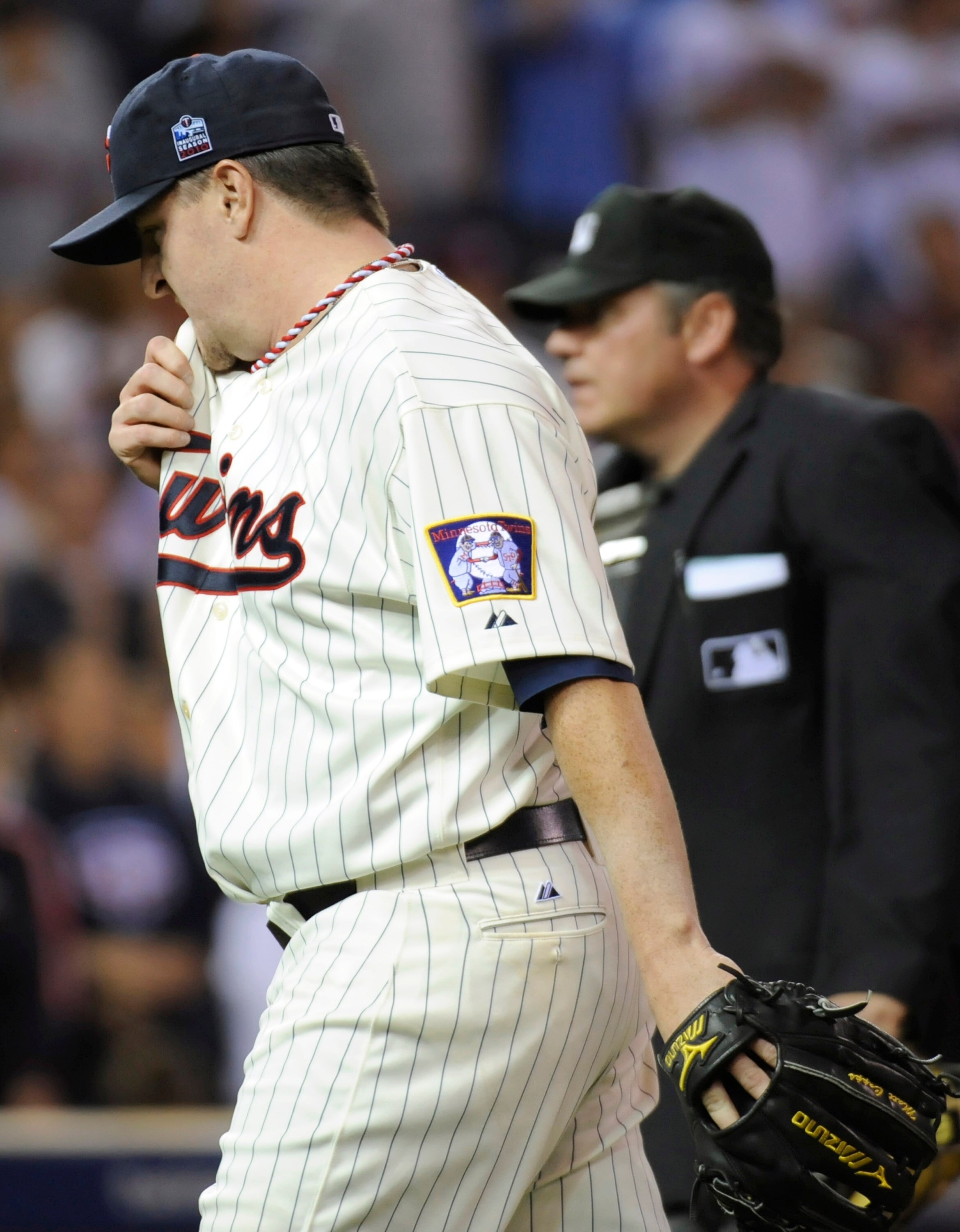 MINNEAPOLIS, MN - OCTOBER 7: Matt Capps #55 of the Minnesota Twins walks to the dugout following the top of the ninth inning during game two of the ALDS game against the New York Yankees on October 7, 2010 at Target Field in Minneapolis, Minnesota. (Photo