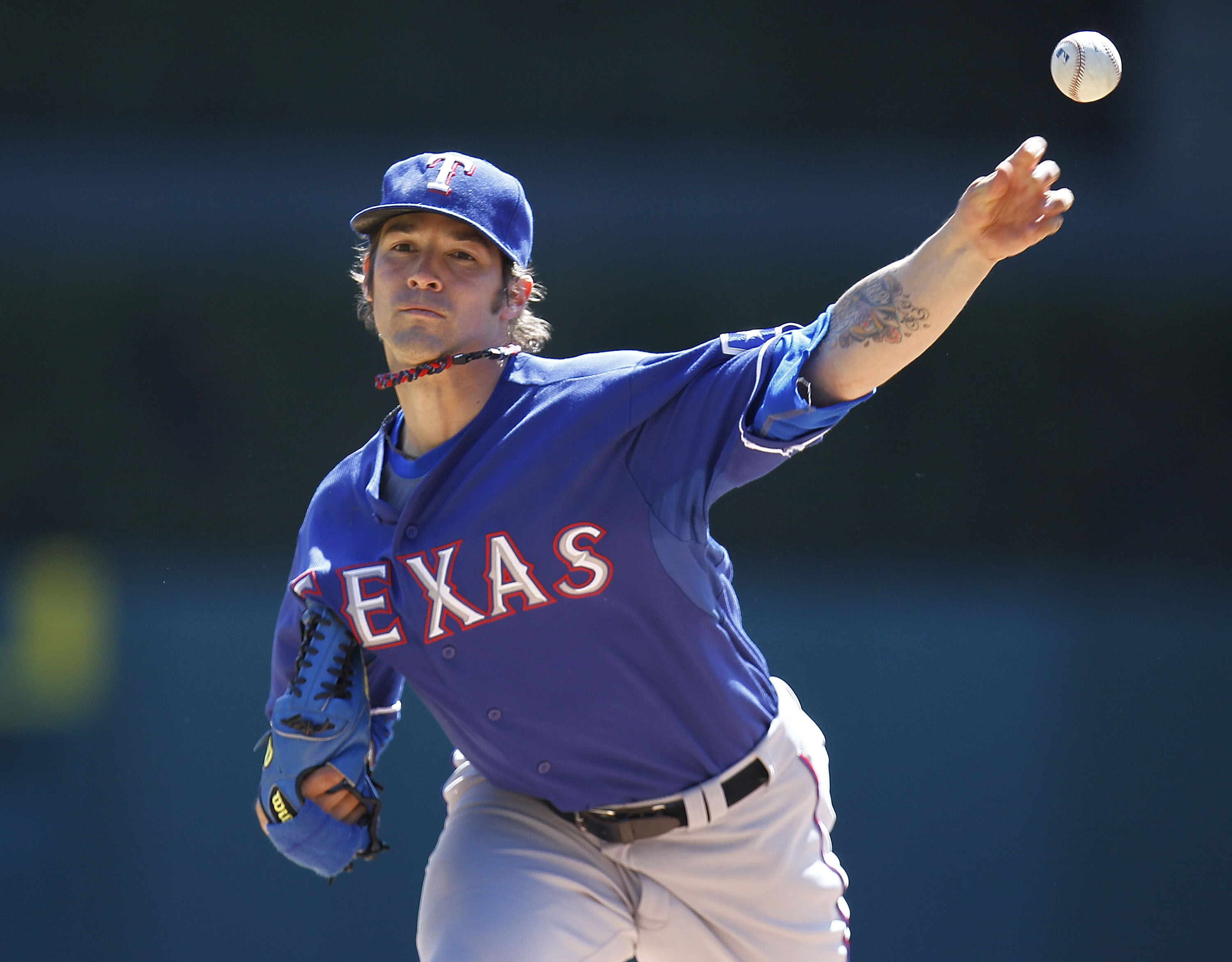 DETROIT, MI - APRIL 12:  C.J. Wilson #36 of thde Texas Rangers thows a warm up pitch while playing the Detroit Tigers at Comerica Park on April 12, 2011 in Detroit, Michigan.  (Photo by Gregory Shamus/Getty Images)