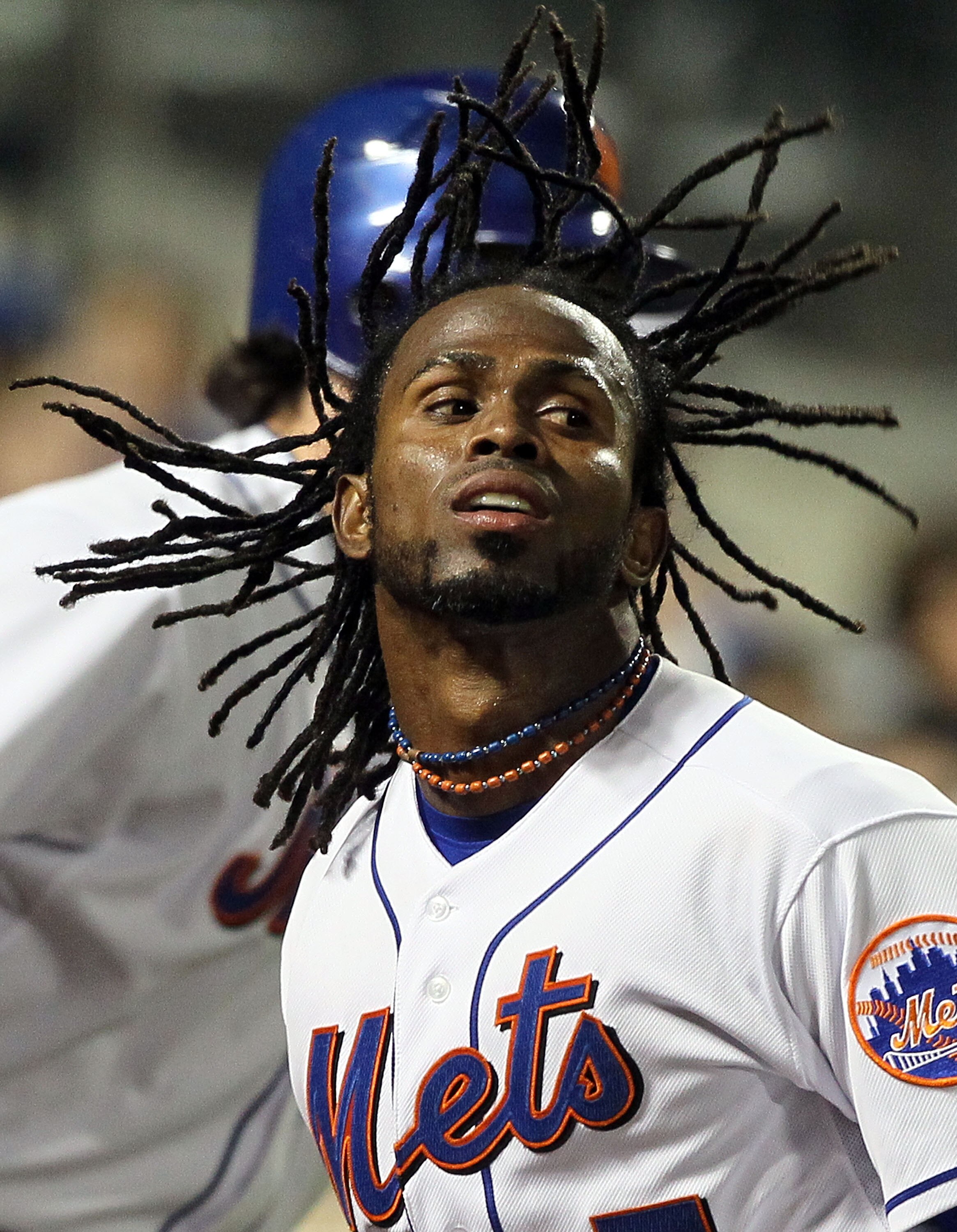 NEW YORK, NY - APRIL 11:  Jose Reyes #7 of the New York Mets celebrates after scoring a run in the third inning against the Colorado Rockies on April 11, 2011 at Citi Field in the Flushing neighborhood of the Queens borough of New York City.  (Photo by Ji