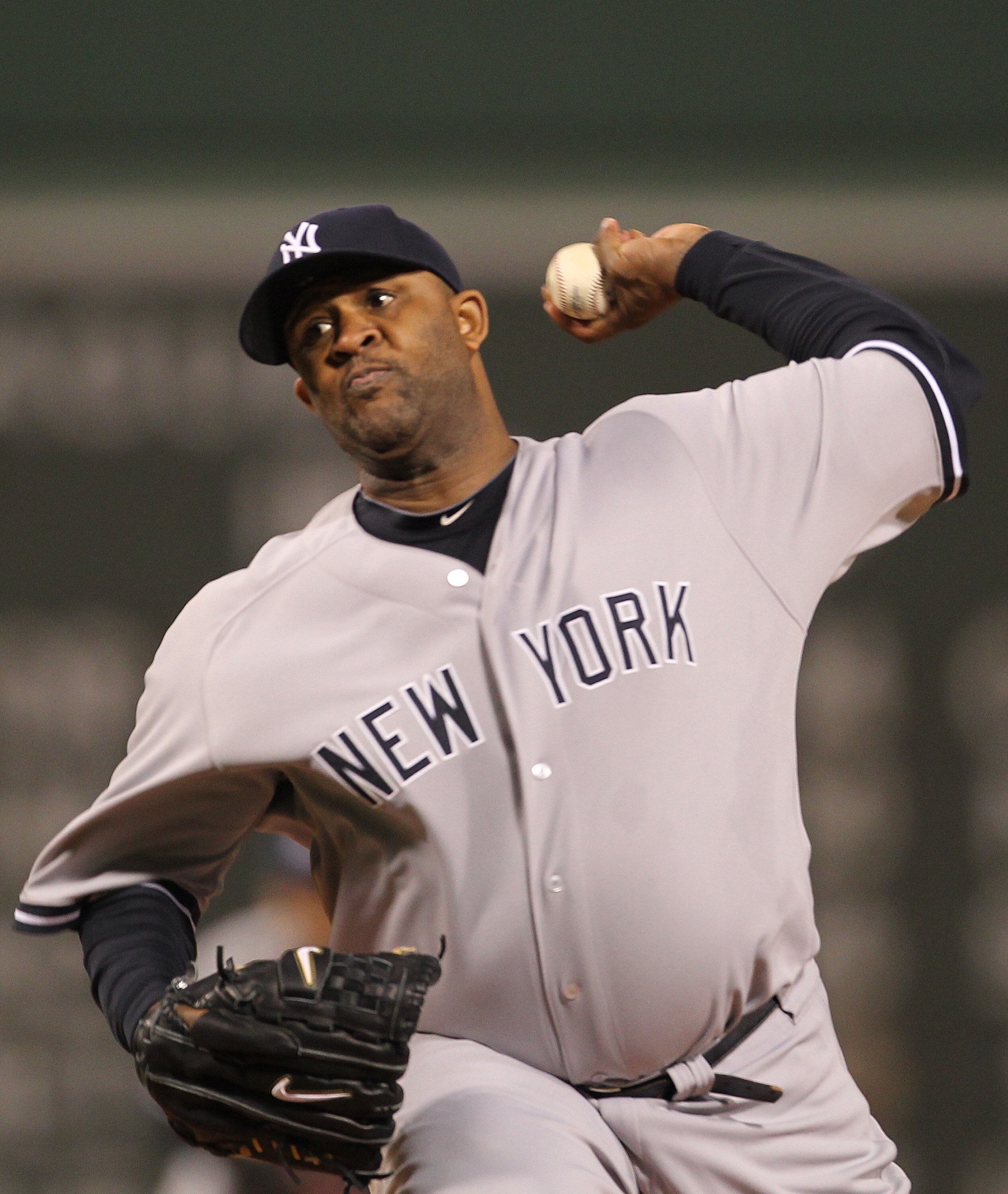 BOSTON, MA - APRIL 10:  CC Sabathia #52 of the New York Yankees throws against the Boston Red Sox at Fenway Park April 10, 2011 in Boston, Massachusetts. (Photo by Jim Rogash/Getty Images)