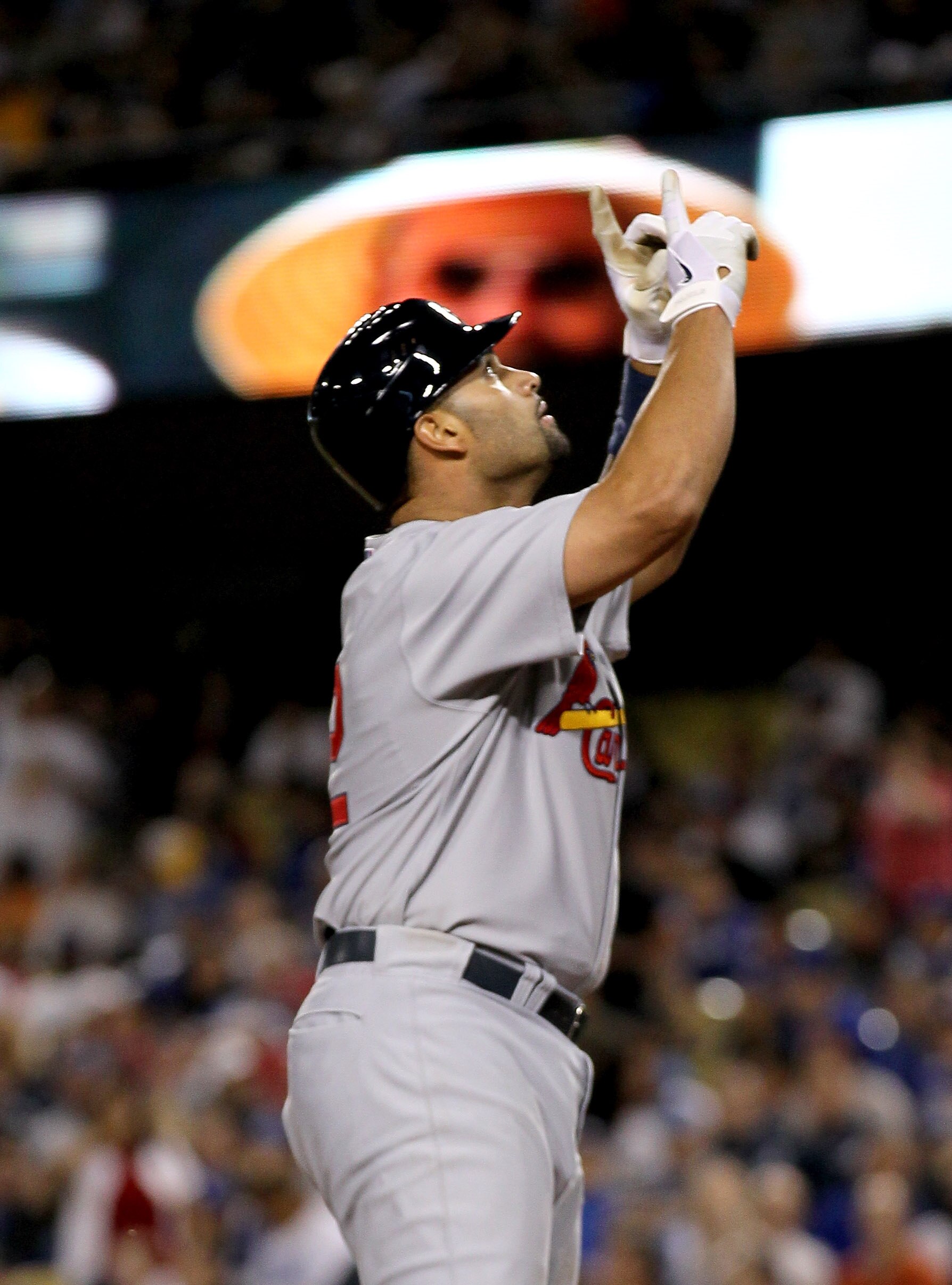 LOS ANGELES, CA - APRIL 15:  Albert Pujols #5 of the St. Louis Cardinals celebrates as he scores after hitting his second home run of the game in the seventh inning against the Los Angeles Dodgers on April 15, 2011 at Dodger Stadium in Los Angeles, Califo