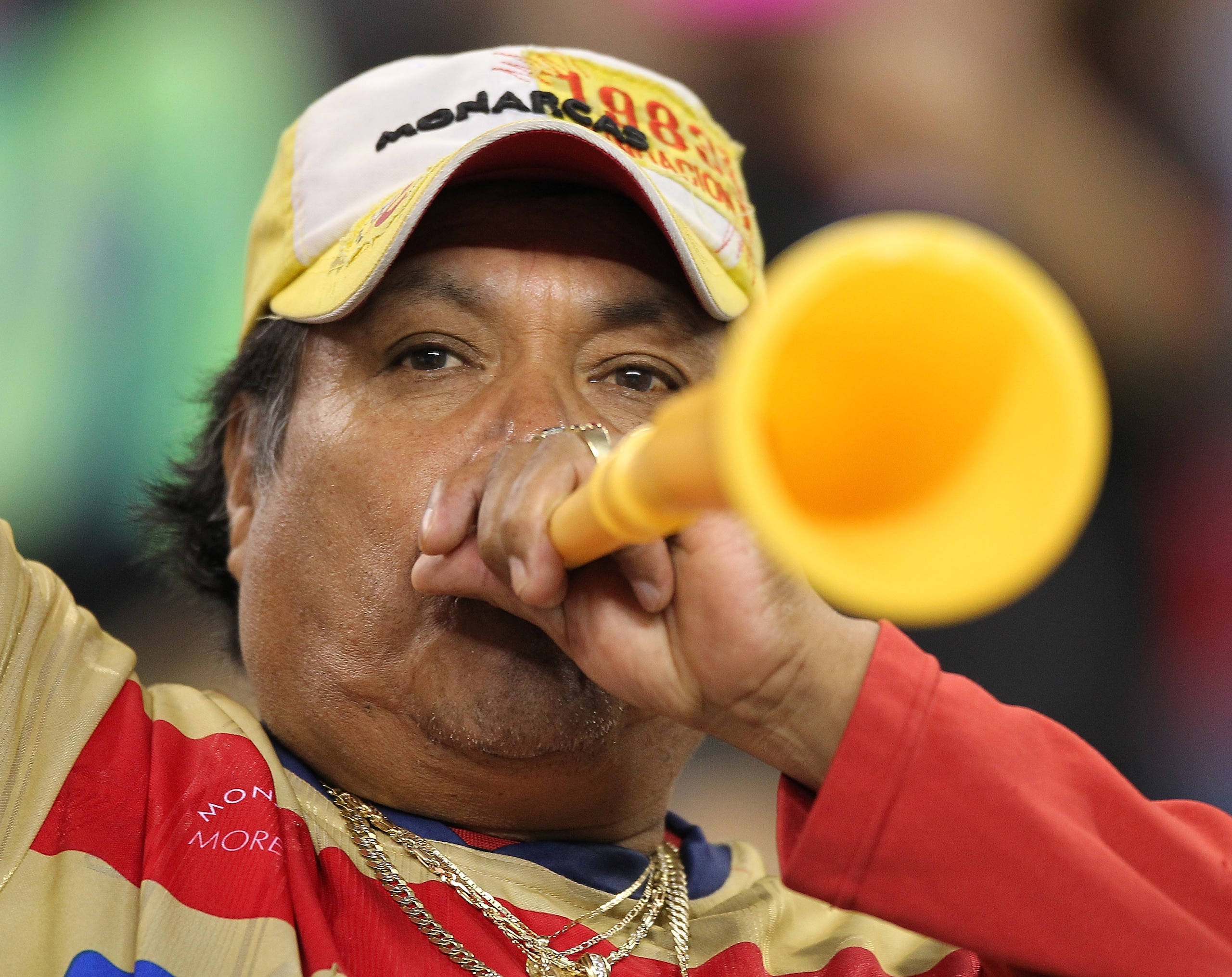 SEATTLE - OCTOBER 12:  A fan of Chivas de Guadalajara blows a vuvuzela during the game against the Seattle Sounders FC on October 12, 2010 at Qwest Field in Seattle, Washington. The Sounders defeated Chivas de Guadalajara 3-1. (Photo by Otto Greule Jr/Get