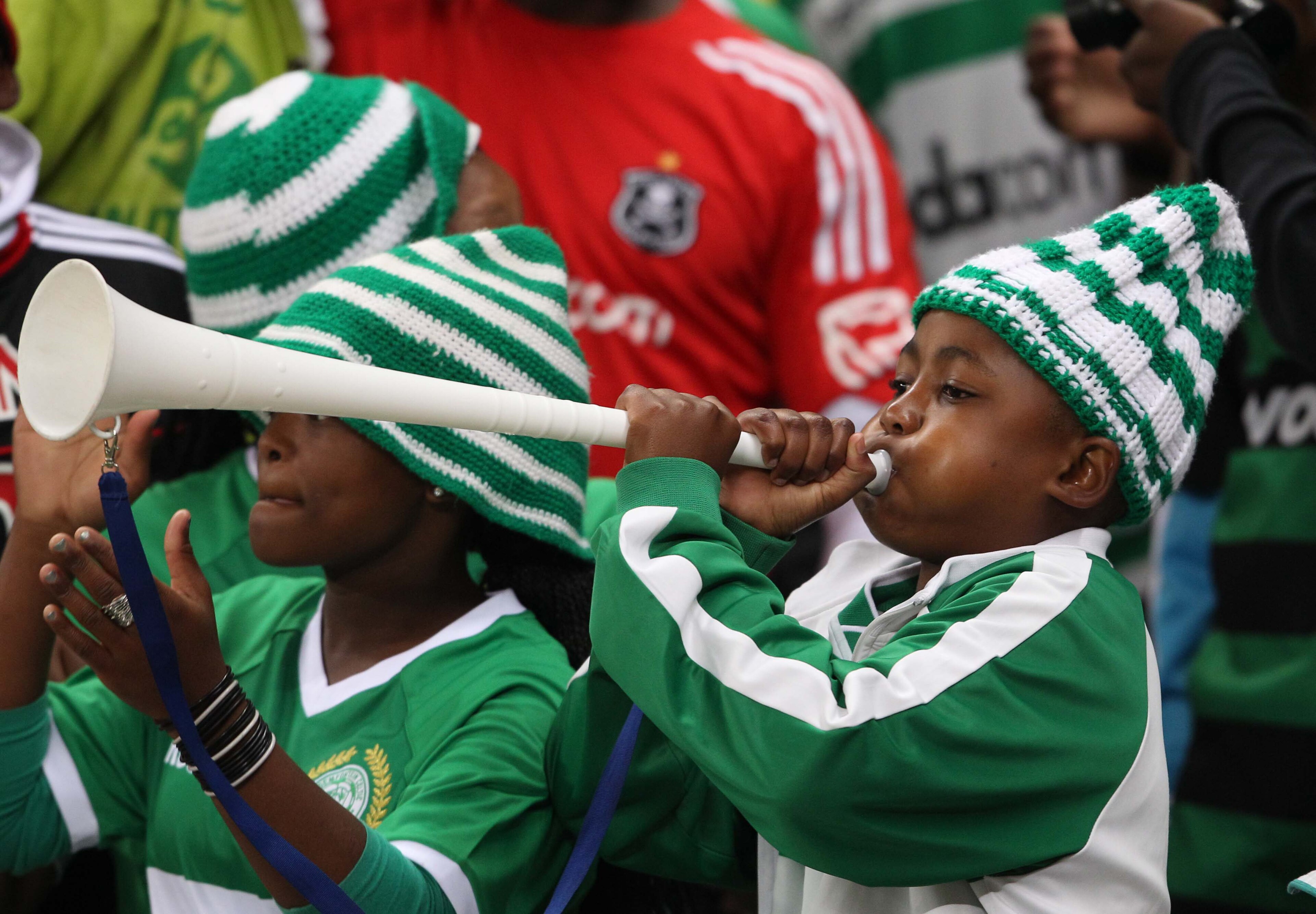 CAPE TOWN, SOUTH AFRICA - AUGUST 27:Fans blow vuvuzelas 2during the Absa Premiership match between Vasco Da Gama and Orlando Pirates, at Cape Town Stadium on August 27, 2010 in Cape Town, South Africa. (Photo by Carl Fourie/Gallo Images/Getty Images)