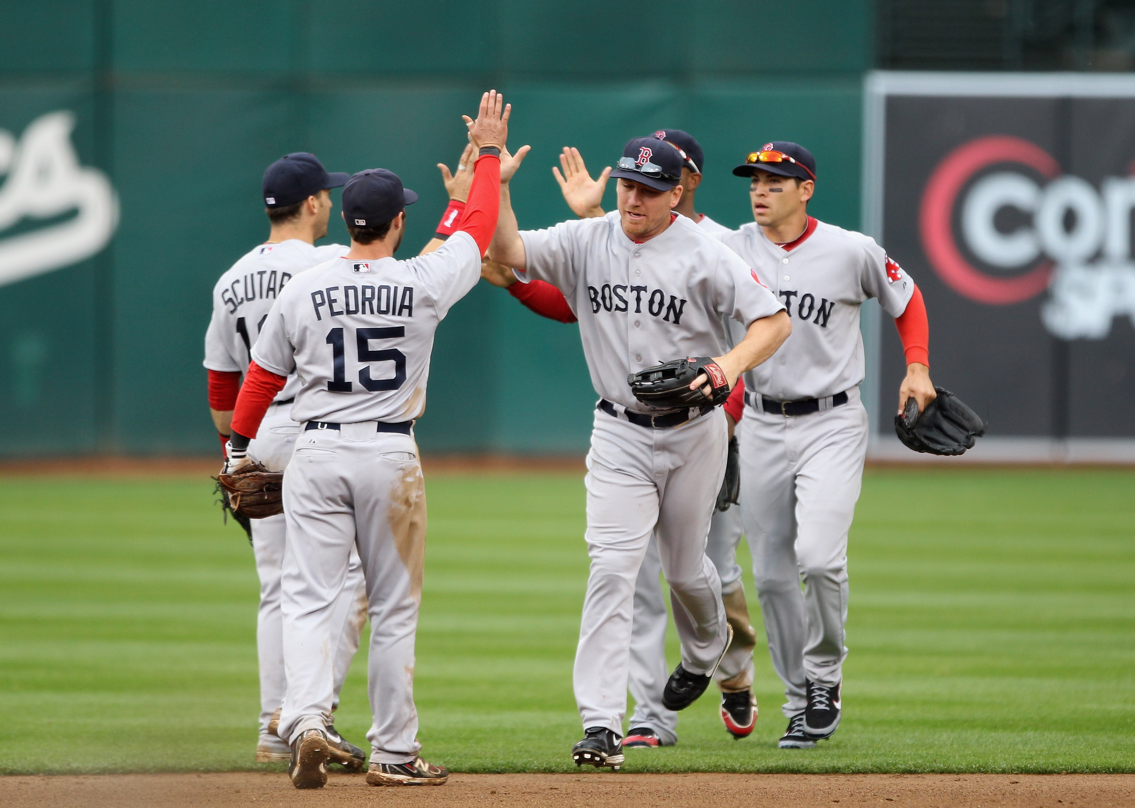 OAKLAND, CA - APRIL 20:  The Boston Red Sox celebrate after they beat the Oakland Athletics at Oakland-Alameda County Coliseum on April 20, 2011 in Oakland, California.  (Photo by Ezra Shaw/Getty Images)