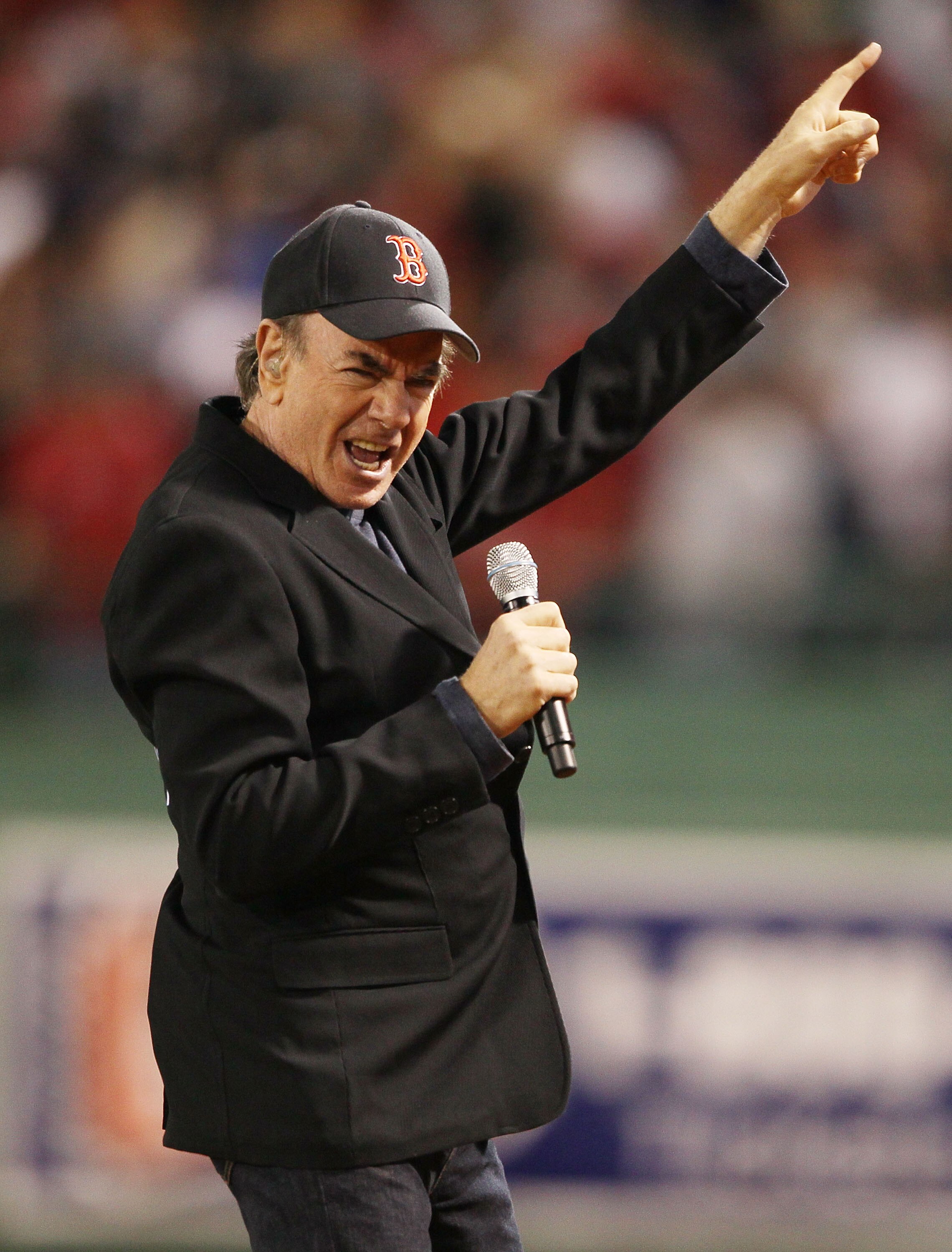 BOSTON - APRIL 04:  Neil Diamond sings his song 'Sweet Caroline' in the eighth inning as the Boston Red Sox play the New York Yankees on April 4, 2010 during Opening Night at Fenway Park in Boston, Massachusetts.  (Photo by Elsa/Getty Images)