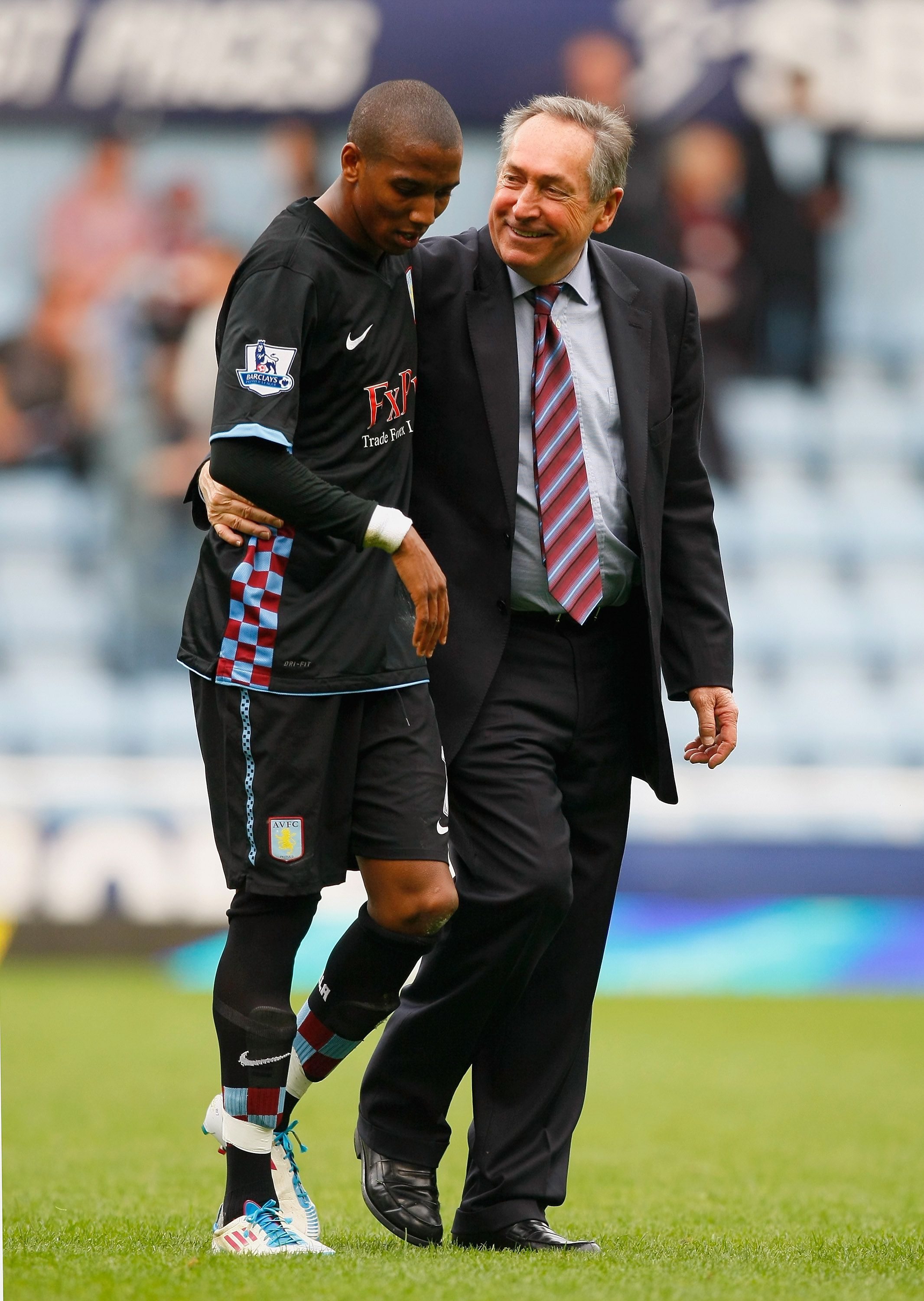 LONDON, ENGLAND - APRIL 16:  Ashley Young of Aston Villa and Aston Villa manager Gerard Houllier celebrate victory in the Barclays Premier League match between West Ham United and Aston Villa at the Boleyn Ground on April 16, 2011 in London, England.  (Ph