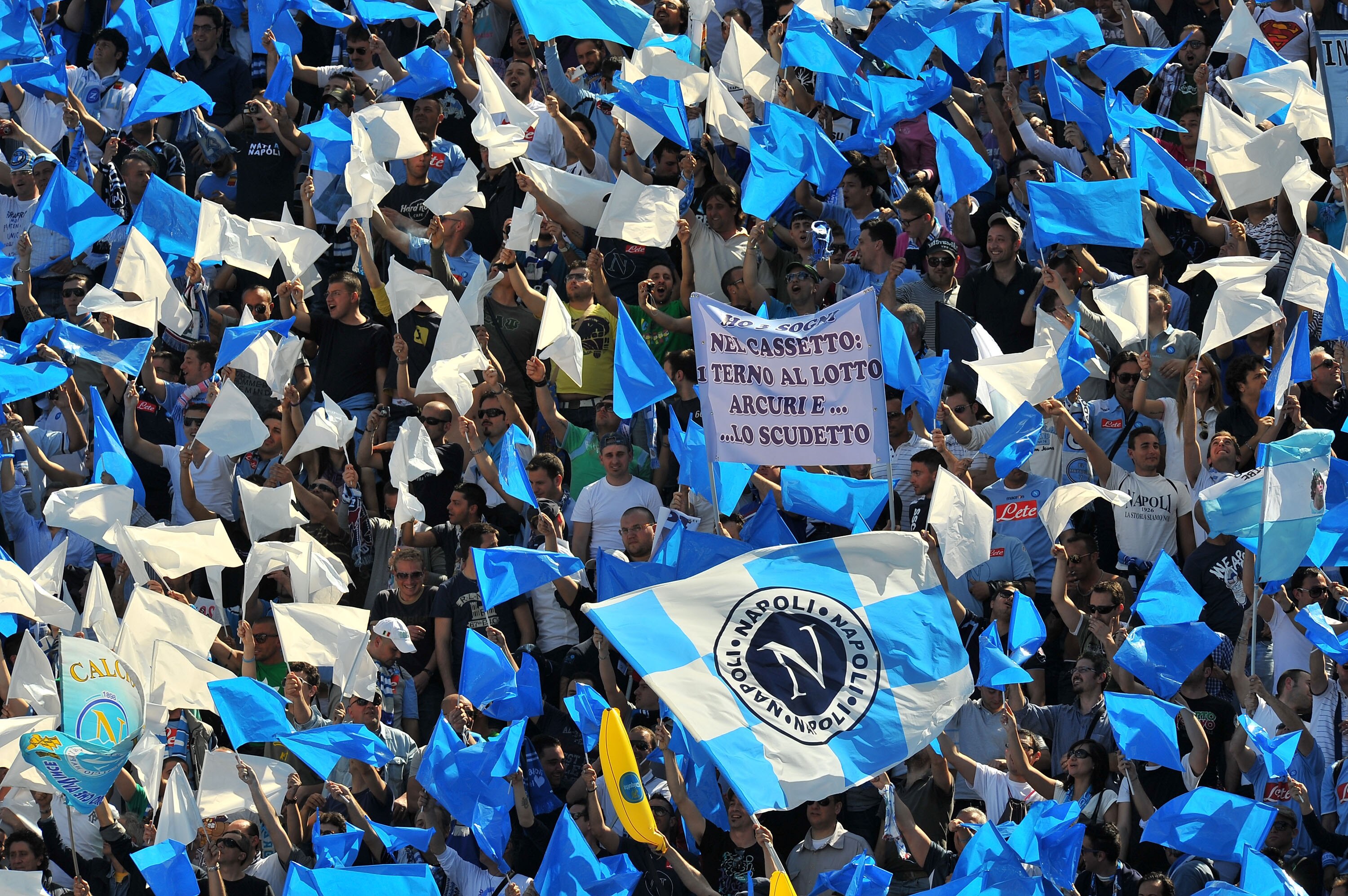 BOLOGNA, ITALY - APRIL 10:  Supporters of Napoli wave flags during the Serie A match between Bologna FC and SSC Napoli at Stadio Renato Dall'Ara on April 10, 2011 in Bologna, Italy.  (Photo by Massimo Paolone / Iguana Press/Getty Images)